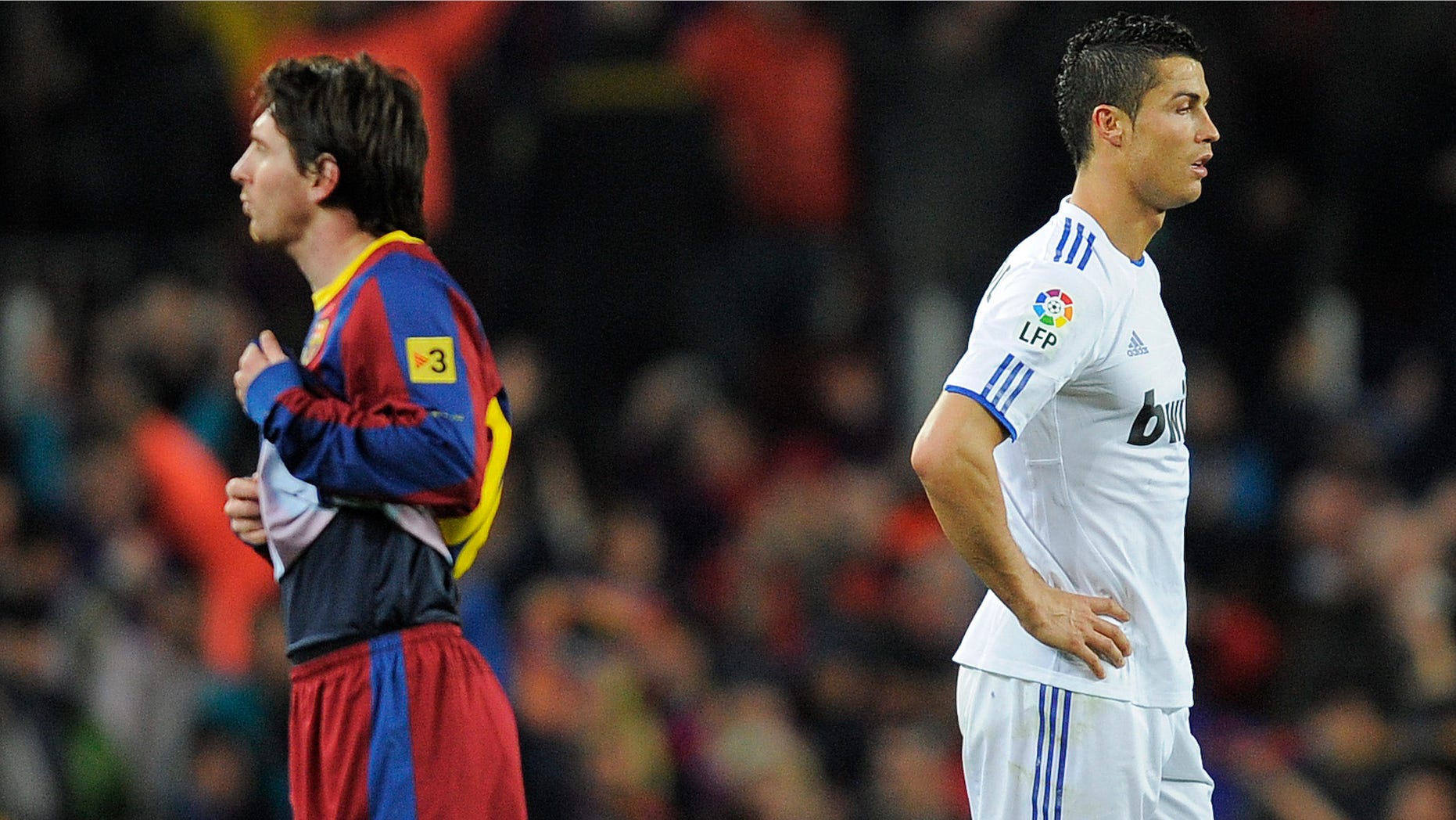 Cristiano Ronaldo of Real Madrid (R) and Lionel Messi of FC Barcelona look on during the La Liga match between Barcelona and Real Madrid at the Camp Nou Stadium on November 29, 2010 in Barcelona, Spain.