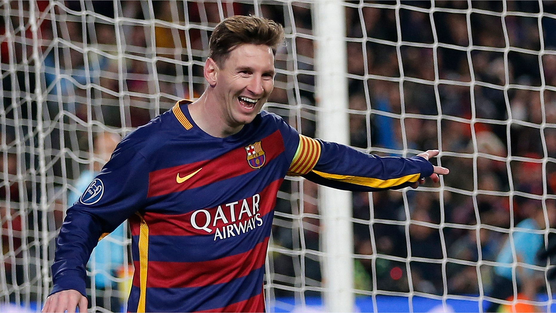 Barcelona's Lionel Messi, left, celebrates after scoring his team's 5th goal during the Group E Champions League soccer match between Barcelona and Roma at the Camp Nou stadium in Barcelona, Spain, Tuesday Nov. 24, 2015. (AP Photo/Emilio Morenatti)