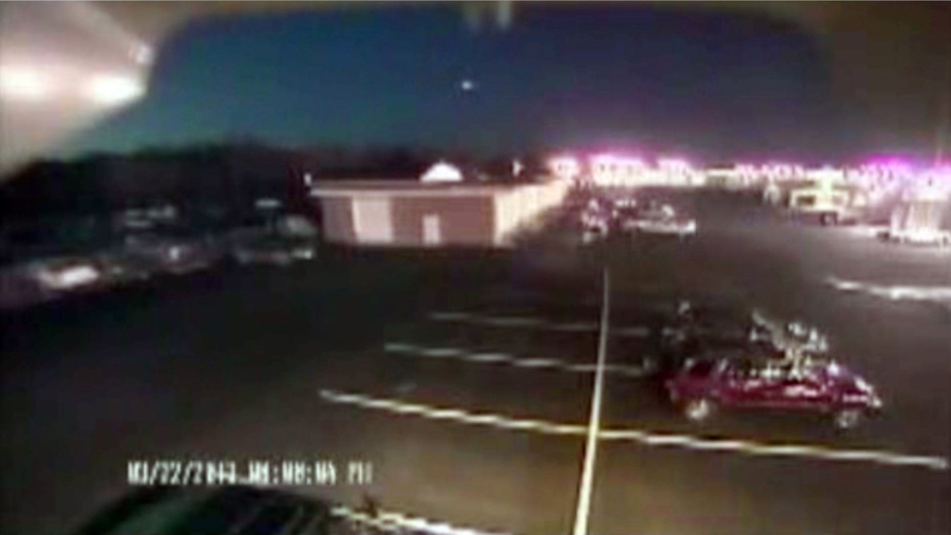 March 22, 2013: A bright flash of light, top center, streaks across the early-evening sky in what experts say was almost certainly a meteor coming down in Seaford, Del.