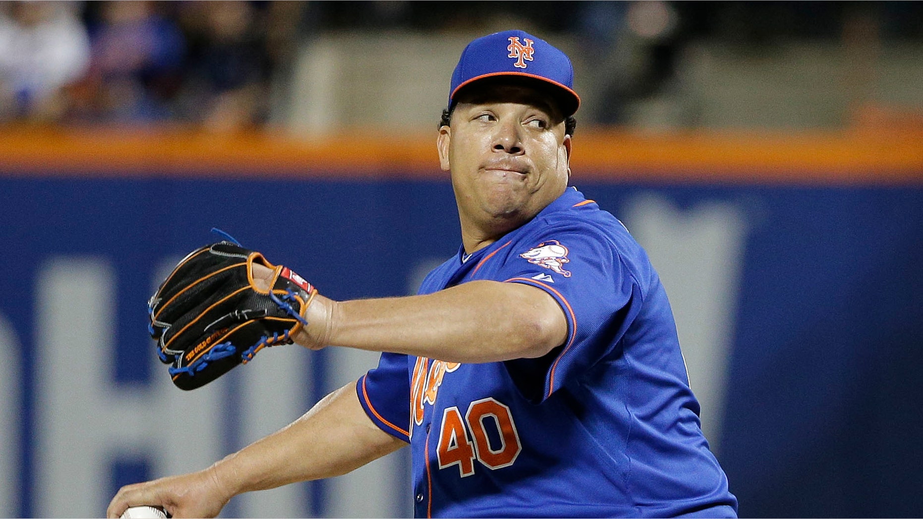FILE - In this Monday, Oct. 12, 2015 file photo, New York Mets pitcher Bartolo Colon (40) delivers against the Los Angeles Dodgers during the sixth inning of baseball's Game 3 of the National League Division Series in New York. A person familiar with the negotiations says 42-year-old pitcher Bartolo Colon has agreed to a $7.25 million, one-year contract to remain with the New York Mets, Wednesday, Dec. 16, 2015. (AP Photo/Julie Jacobson, File)