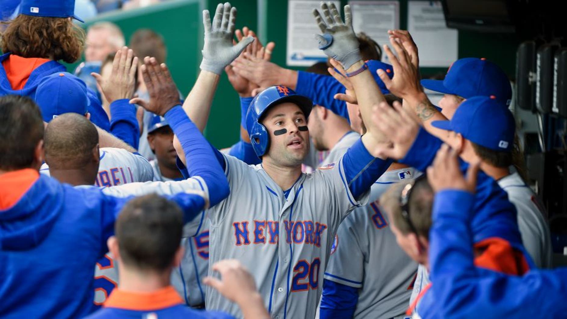 KANSAS CITY, MO - APRIL 5: Neil Walker #20 of the New York Mets celebrates his two-run home run with teammates in the fourth inning during a game against the Kansas City Royals at Kauffman Stadium on April 5, 2016 in Kansas City, Missouri. (Photo by Ed Zurga/Getty Images)