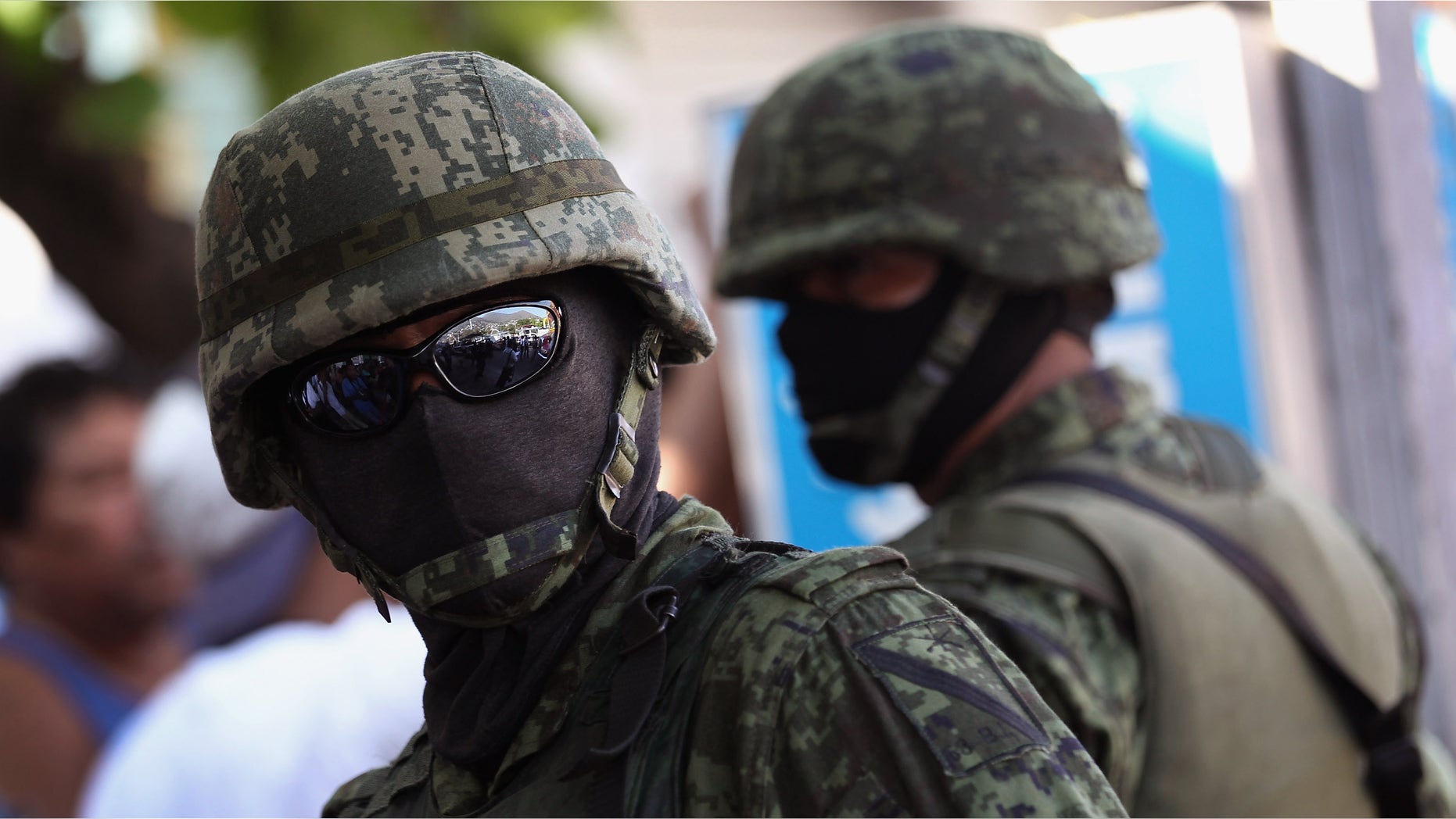 ACAPULCO, MEXICO - FEBRUARY 29: Mexican army soldiers stand guard at the site of a suspected drug execution on February 29, 2012 in Acapulco, Mexico. Drug violence surged in the coastal resort last year, making Acapulco the second most deadly city in Mexico after Juarez. One of the country's top tourist destinations, Acapulco has suffered a drop in business, especially from foreign tourists. Toursim accounts for some 9 percent of Mexico's economy and about 70 percent of the output of Acapulco's state of Guerrero. (Photo by John Moore/Getty Images)