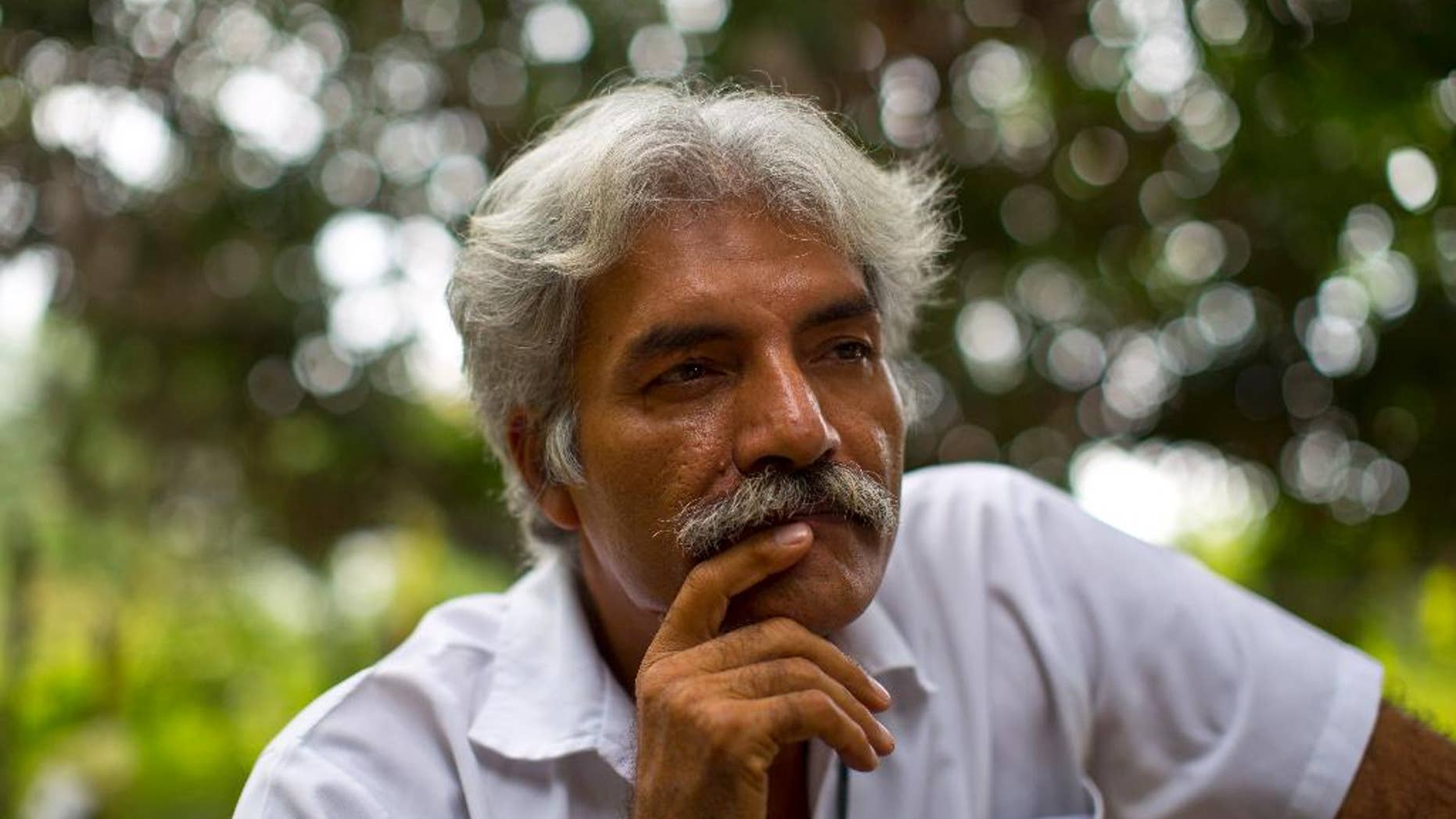 In this Nov. 6, 2013 photo, Doctor Jose Manuel Mireles, leader of his town's self-defense group, pauses during an interview with the Associated Press at his ranch in the town of Tepalcatepec, in the state of Michoacan, Mexico. The documentary “Cartel Land”, produced and directed by New York-based director Matthew Heineman paired the story of Mireles and his “self-defense” forces battling drug cartels with the tale of a vigilante north of the border: war veteran Tim “Nailer” Foley and his Arizona Border Recon. The film opens on July 2, 2015 in Mexico, a day later in New York and and later in other U.S. cities. (AP Photo/Dario Lopez-Mills)