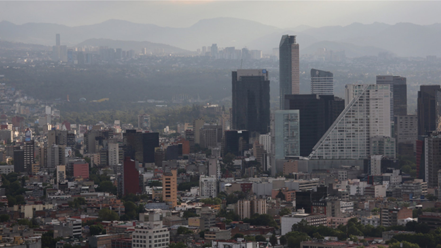 MEXICO CITY, MEXICO - JUNE 26: A Mexico City skyline is seen through the haze from the Latino Tower on June 26, 2012 in Mexico City, Mexico. Mexicans go to the polls to elect a new president this Sunday, July 1. (Photo by John Moore/Getty Images)