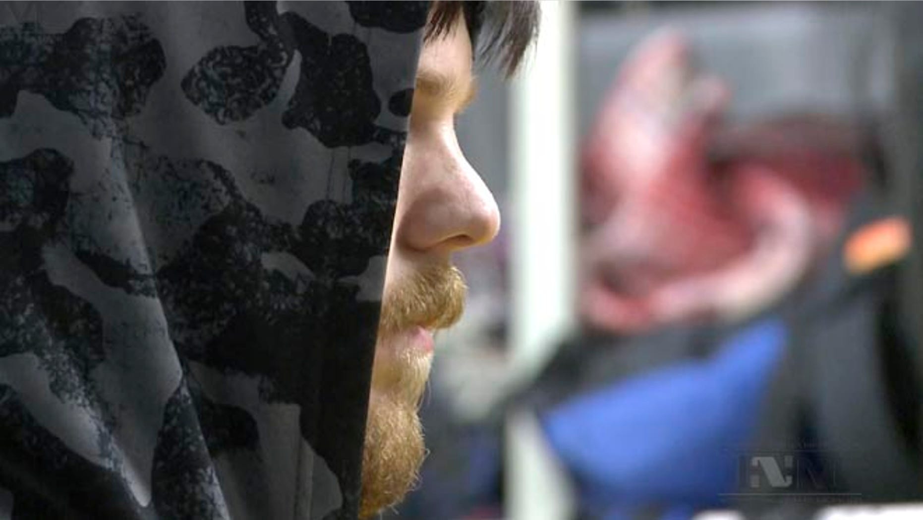 This frame grab from a Thursday, Jan. 28, 2016 taken from a video provided by Mexico's Instituto Nacional de Migracion, INM, shows a hooded Ethan Couch, as he is processed by Mexican immigration agents, in Mexico City. INM said that Couch, who used an "affluenza" defense in a 2013 fatal drunken-driving accident in Texas, was taken to the Mexico City airport from an immigration holding center, ending his month-long stay in Mexico.(Instituto Nacional de Migracion, INM via AP)