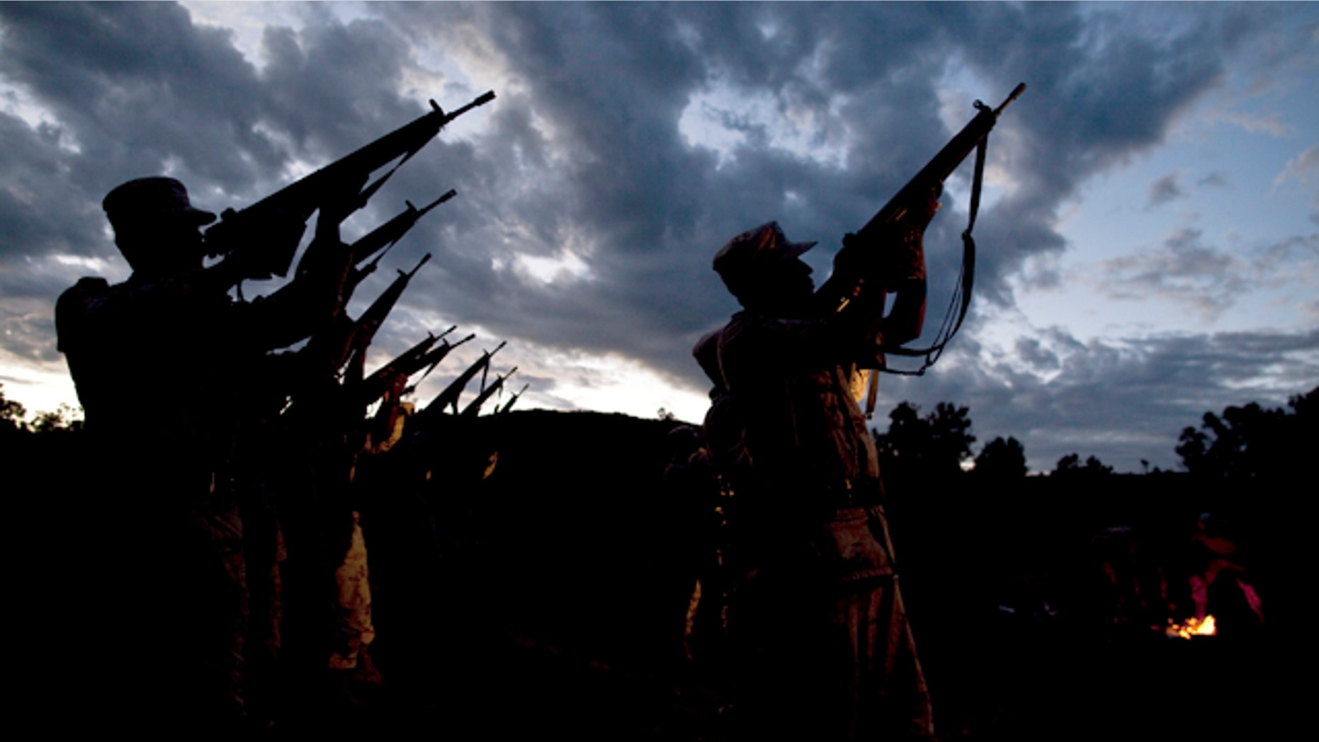 Sept. 30, 2010: Mexican Soldiers check their weapons after waking up early for a marijuana destruction operation in the Sierra de Juarez in Ensenada, Mexico.