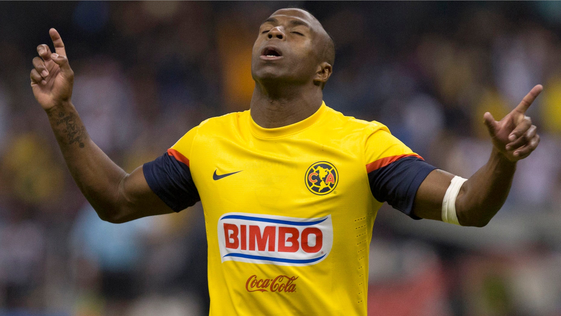 FILE - In this Jan. 19, 2013 file photo, America's Christian Benitez, celebrates his goal against Atlante at a Mexican soccer league match in Mexico City. Benitez, from Ecuador, died Monday, July 29, 2013, a day after playing in a match for Qatari club El Jaish, the team said. The club provided no further details about the death of the 27-year-old Benitez, who moved from Mexican club America to play in Qatar in 2013. (AP Photo/Christian Palma, File)