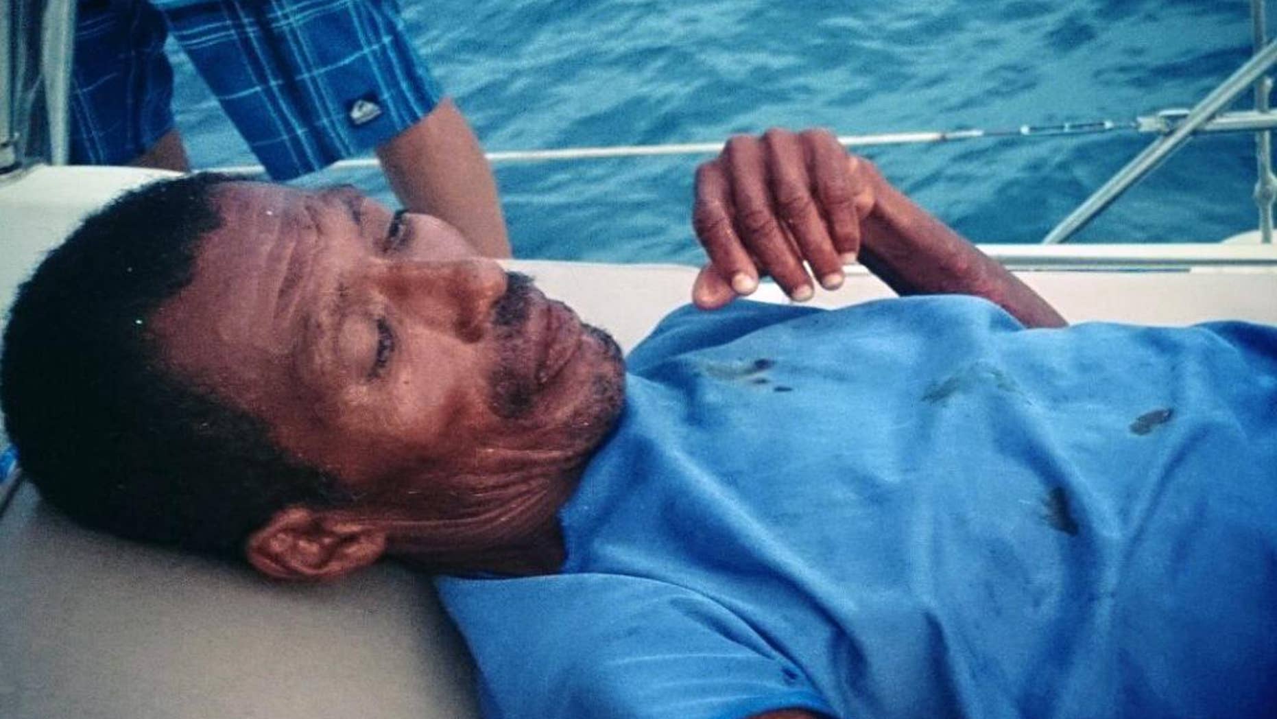 In this Monday, Sept. 22, 2014 photo courtesy of Adonai Vazquez, Mexican fisherman Raymundo Rodriguez, who had been adrift at sea for a week, rests on a boat after he was rescued off the coast of Mexico. Rodriguez was rescued by people aboard a Mexican pleasure boat after his fishing boat was swamped by Tropical Storm Polo. Crew members found the exhausted man as he floated in a giant foam cooler about 6 miles (10 kilometers) off Acapulco. Rodriguez said his fishing companion Mario Morales died farther out to sea. (AP Photo/Courtesy of Adonai Vazquez)