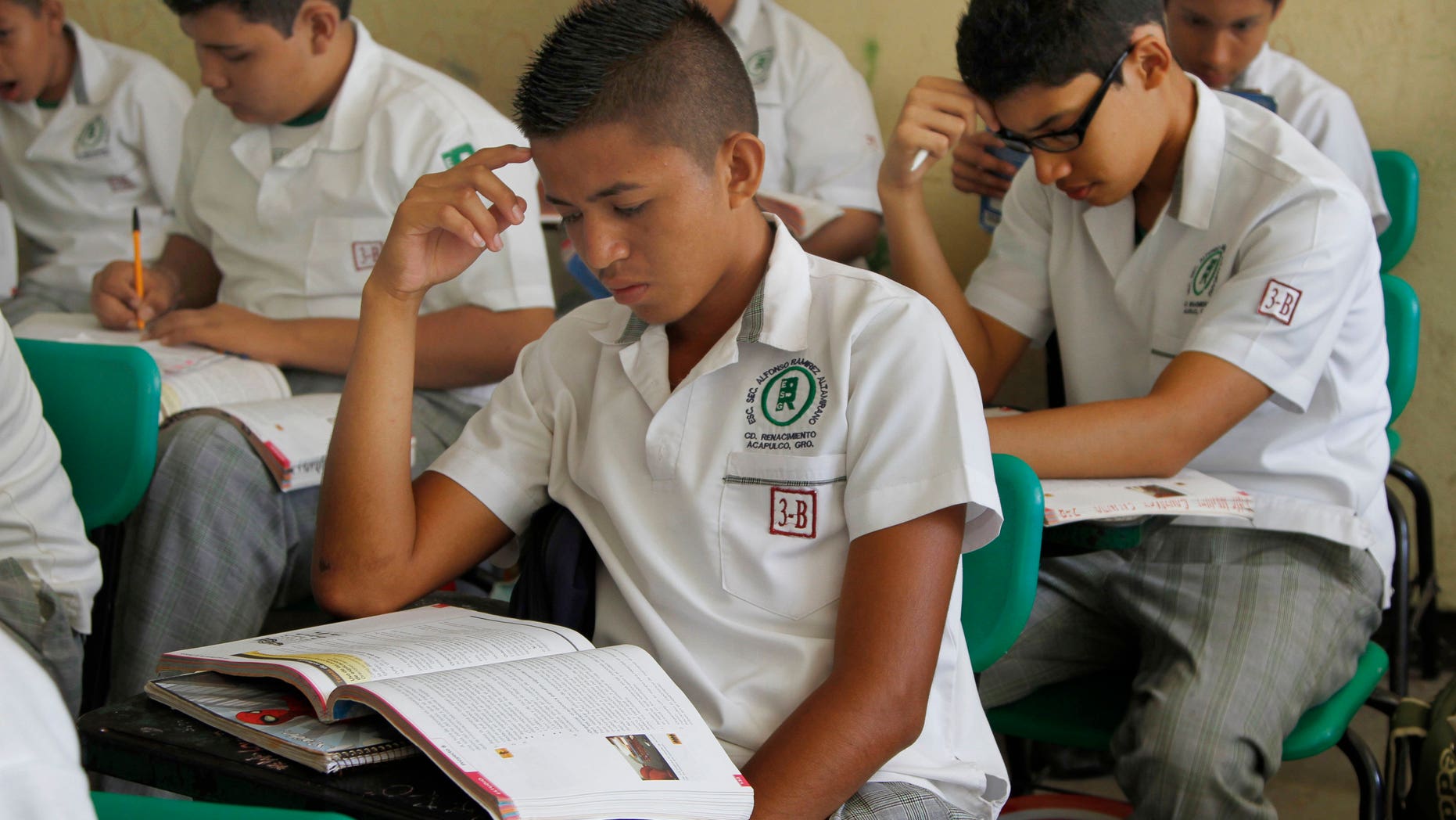 In this April 9, 2013 file photo, primary school students study in their classroom in Acapulco, Mexico.