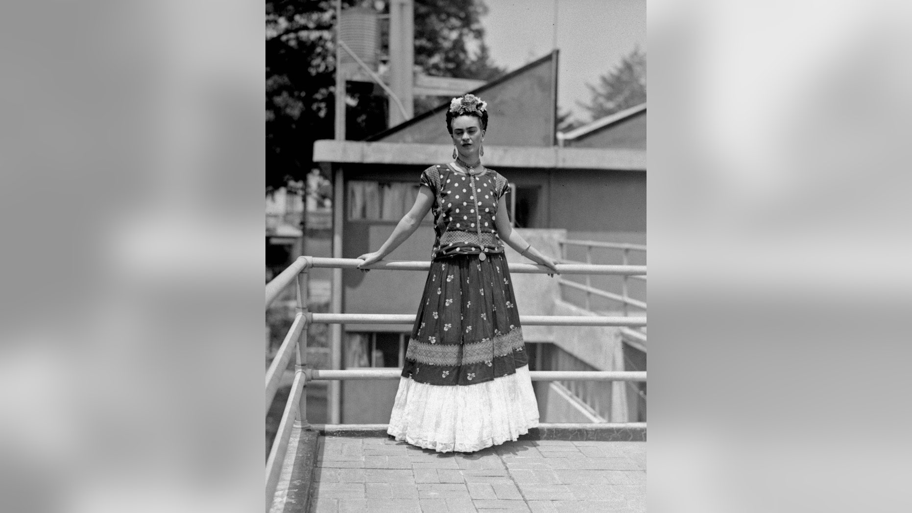 FILE - In this April 14, 1939 file photo, painter and surrealist Frida Kahlo, who was the wife of noted Mexican muralist Diego Rivera, poses at her home in Mexico City. A full collection from Kahlo's wardrobe will go on public display Nov. 22 in Mexico City after being locked for nearly 50 years in her armoires and dressers: jewelry, shoes and clothes that still carry the scent of the late artist's perfume and cigarette smoke or stains from painting. (AP Photo/File)