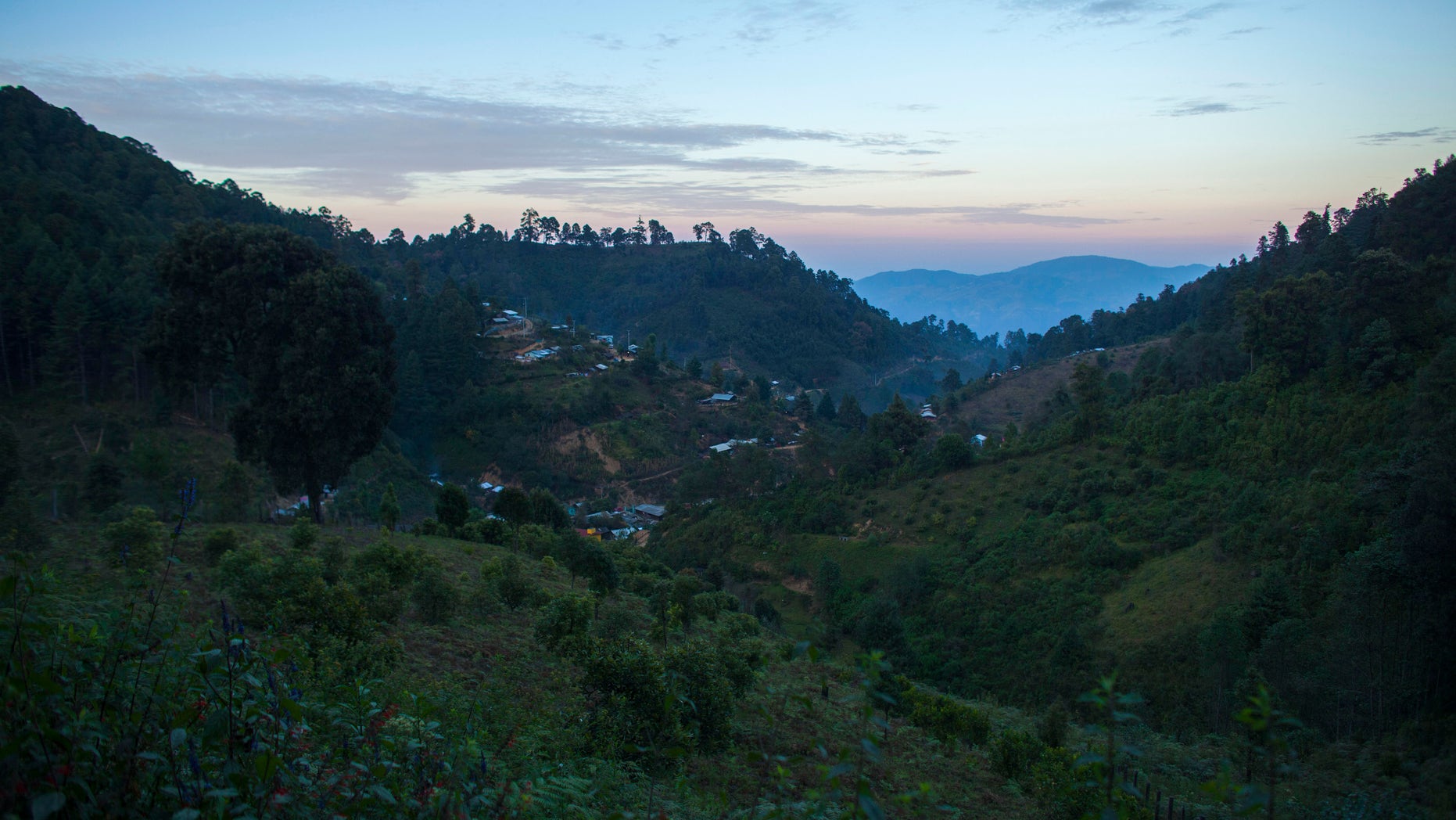 Homes dot the mountainside of the Sierra Madre del Sur where farmers grow poppy in Guerrero state, Mexico.