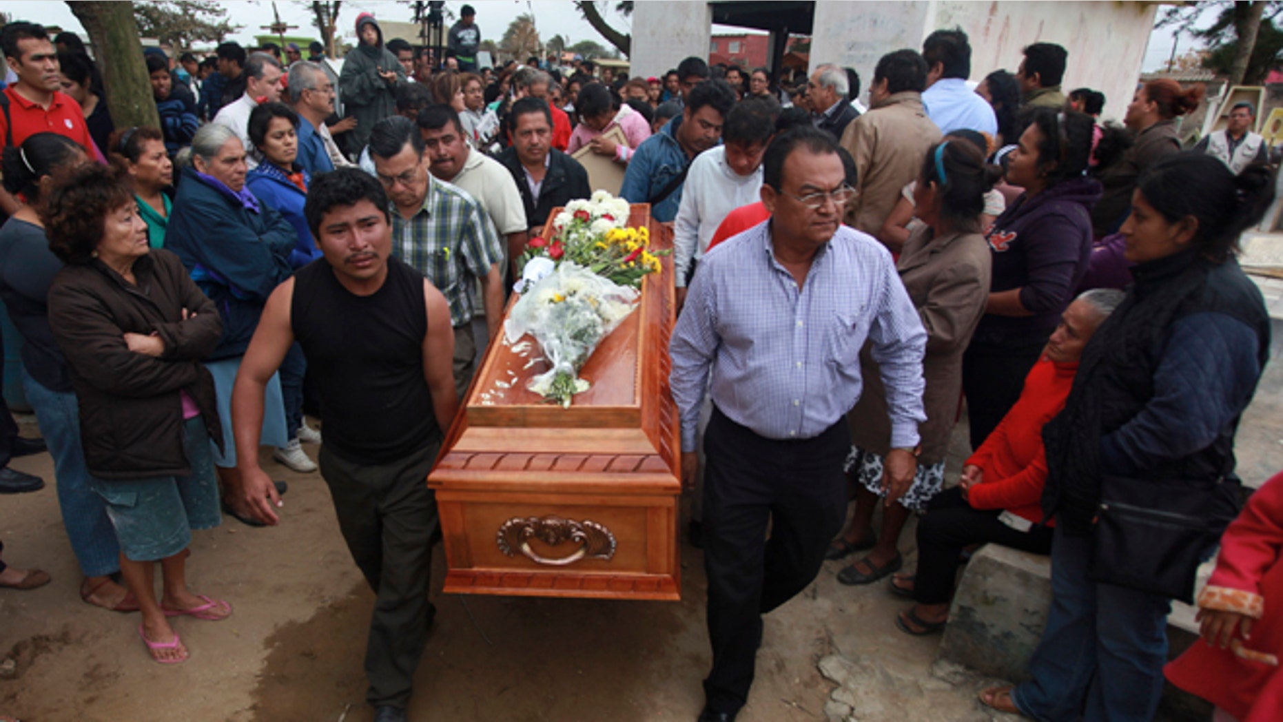 Relatives carry the coffin that contain the remains of slain journalist Gregorio Jiménez as they walk towards the cemetery in Coatzacoalcos, Mexico, Wednesday, Feb. 12, 2014. Veracruz state officials concluded that Jiménez, a police beat reporter, was killed in a personal vendetta, unrelated to his reporting. But journalists throughout Mexico are calling for a thorough investigation. Jimenez is the 12th journalist slain or gone missing since 2010 in the Gulf state of Veracruz. (AP Photo/Felix Marquez)