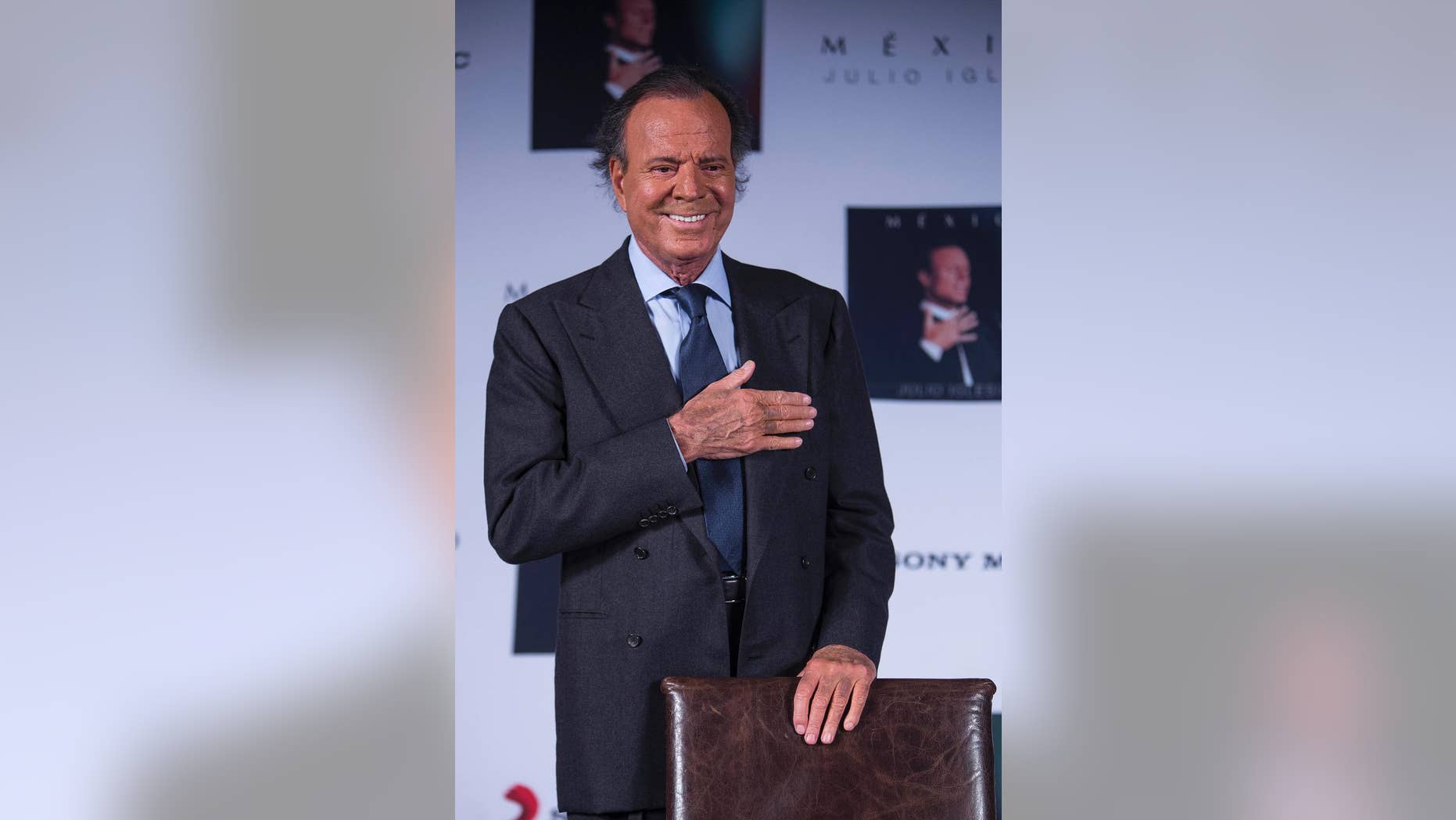 FILE - In this Sept. 23, 2015, file photo, Spain's singer Julio Iglesias acknowledges the media during a press conference promoting his album "Mexico" in Mexico City. Iglesias called Donald Trump a clown during an interview published Wednesday, Oct. 7, 2105, in the Spanish newspaper La Vanguardia, and vowed not to sing again in his casinos. (AP Photo/Christian Palma, File)