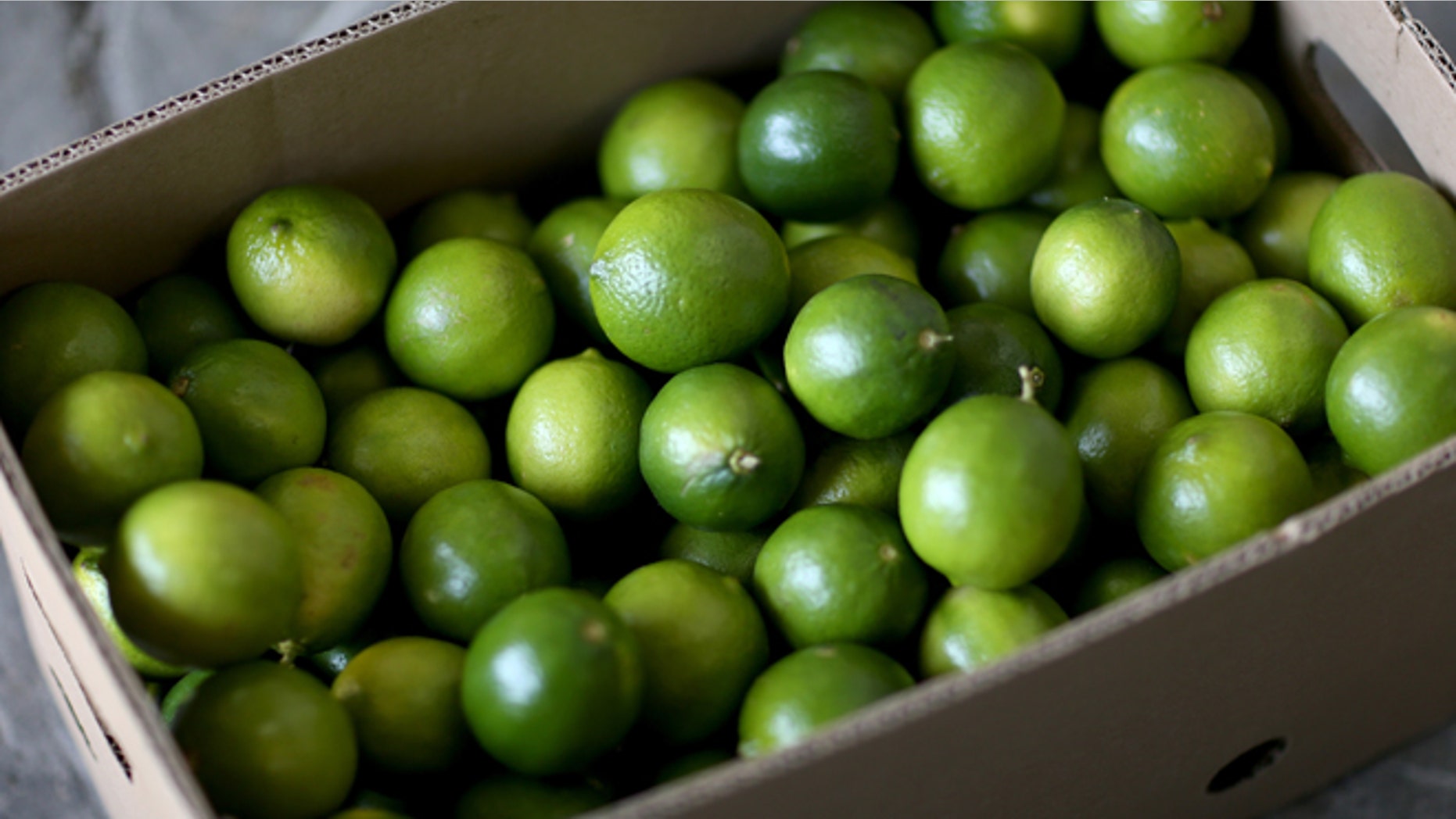MIAMI, FL - MARCH 26: Limes that have been imported from Columbia are boxed at Marco produce on March 26, 2014 in Miami, Florida. Marco Carmenatis from the produce company said they hadn't received any lime imports from Mexico for the last three days as a tight supply in Mexico has driven up the availability as well as the prices for the citrus in the United States. (Photo by Joe Raedle/Getty Images)