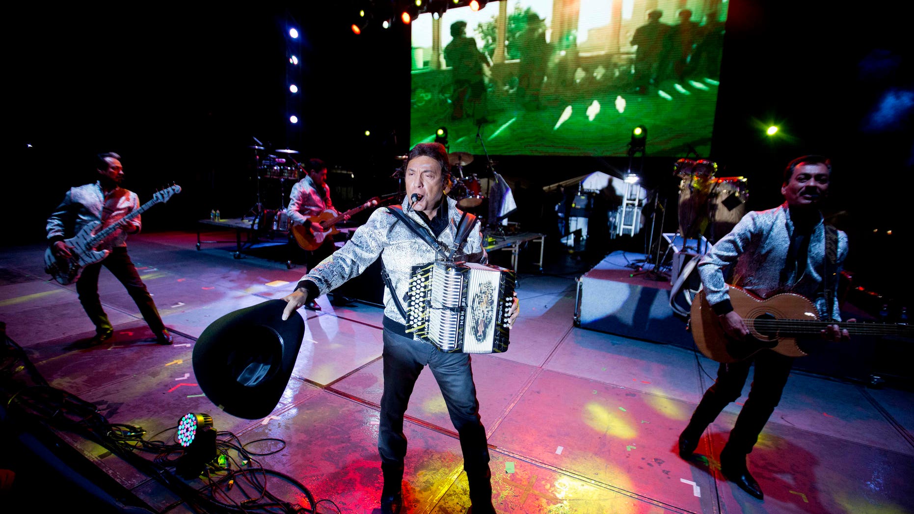 In this Sept. 27, 2014 file photo, Los Tigres del Norte perform at the Somos America music festival in Toluca, Mexico. With Era diferente, the first corrido about gay love, Los Tigres del Norte say they are proud to support the LGBT community. The song is included in their latest album, Realidades.