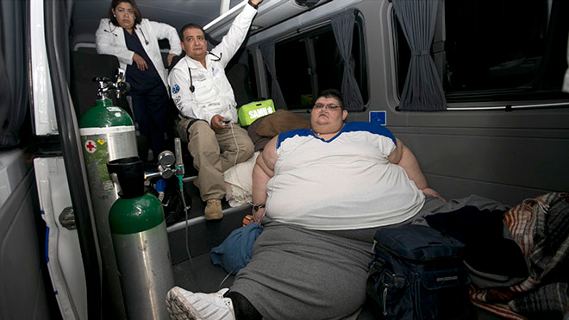 Juan Pedro is taken care of by paramedics on arrival at hospital in Guadalajara, Mexico, Tuesday, Nov. 15, 2016. Juan Pedro,who weighs about 1,100 pounds (500 kilos) and hasn't left his bed in six years has been removed by medical personnel for treatment. His doctor gave the man's name only as Juan Pedro, 32, from the central city of Aguascalientes. (AP Photo/Refugio Ruiz)