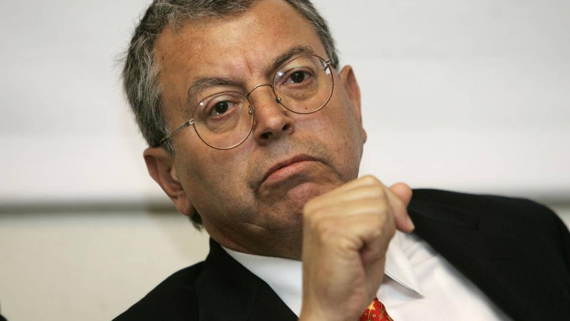 FILE - In this July 25, 2006 file photo, Manuel Camacho Solis, former Mexico City mayor, takes part in a news conference in Washington D.C. An aide to Solis said he died Friday, June 5, 2015, of a brain ailment he had suffered for some time. Local media said it was a brain tumor. He was 69. Solis headed the Mexican government’s peace negotiations with the Zapatista rebels after their 1994 uprising. (AP Photo/Evan Vucci, File)