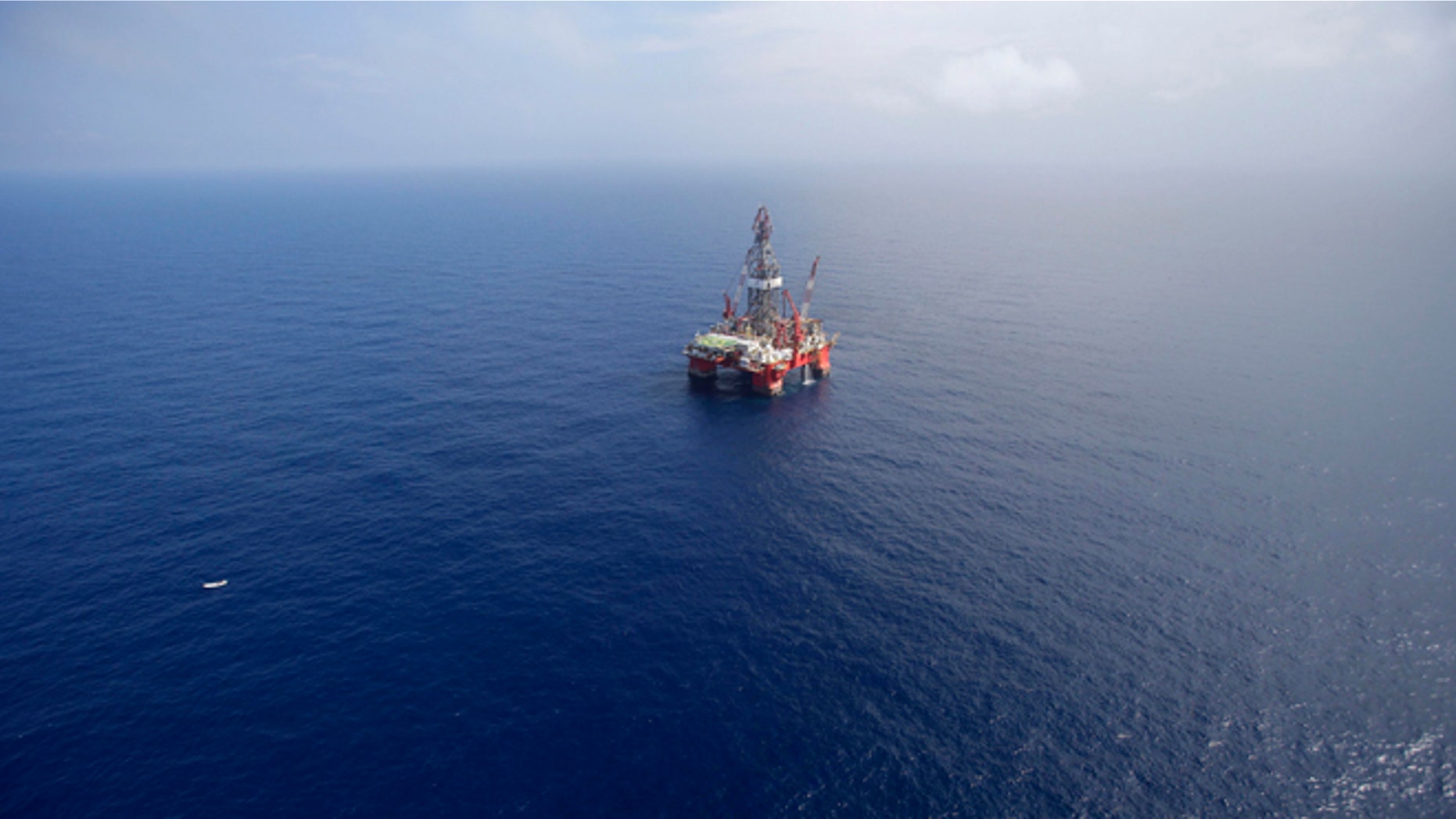 FILE - In this Nov. 22, 2013, file photo, the Centenario deep-water drilling platform stands off the coast of Veracruz, Mexico in the Gulf of Mexico. Mexico's government announced on Thursday, Dec. 11, 2014 the start of bidding for oil exploration rights in 14 areas of the Gulf of Mexico being opened to domestic and international companies as it ends a seven-decade state monopoly on the petroleum business. (AP Photo/Dario Lopez-Mills, File)