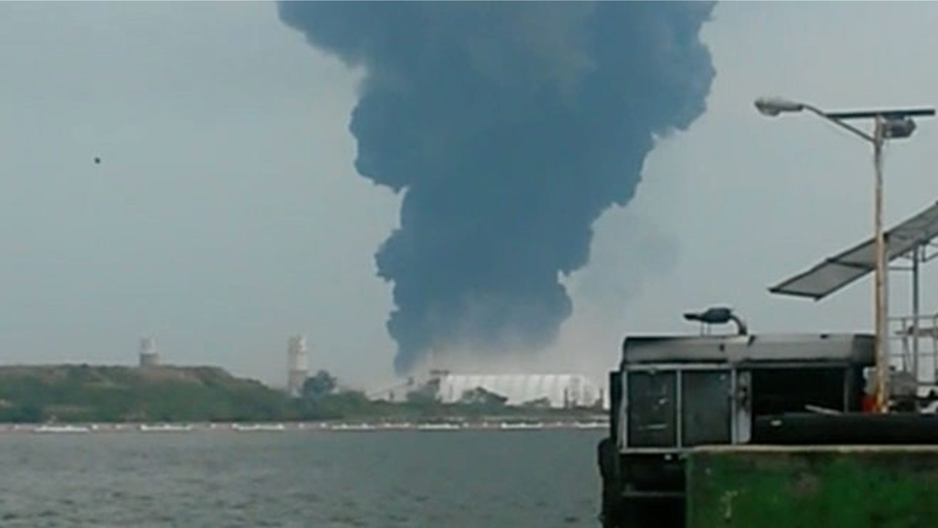 BEST QUALITY AVAILABLE - In this video grab a large plume of smoke rises from the Mexican State oil company Petroleos Mexicanos' petrochemical plant after an explosion in Coatzacoalcos, Mexico, Wednesday, April 20, 2016. The explosion killed several people, injuring dozens and sending flames and a toxin-filled cloud into the air, officials said. (Inmel Enoc via AP)