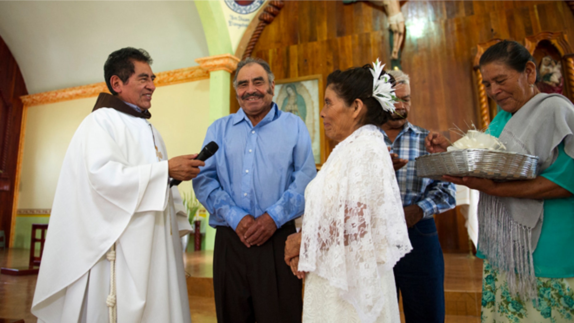 Francisca Santiago, 65, and Pablo Ibarra, 75, exchange wedding vows on July 23, 2016.