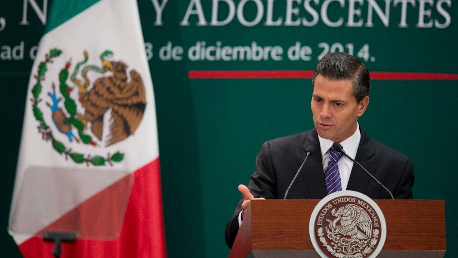 Mexican President Enrique Pena Nieto speaks during a signing ceremony for a new law that further protects children at Los Pinos presidential residence in Mexico City, Wednesday, Dec. 3, 2014. (AP Photo/Eduardo Verdugo)