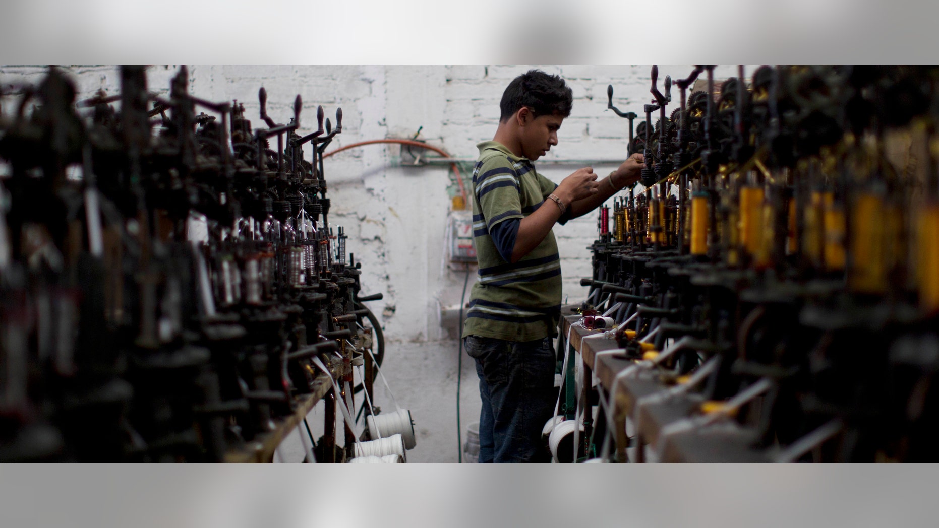 In this Feb. 29, 2012 photo, a worker uses a threading machine at the sombrero shop of Maria de la Luz Yepez, not shown, who is preparing three Mexican style sombreros to give as gifts to Pope Benedict XVI, in the town of San Francisco del Rincon, near Leon, Mexico. The visit of Pope Benedict XVI, his first to Spanish-speaking Latin America, begins on March 23 in Mexico's central state of Guanajuato, where he will spend three days and give an outdoor Mass before heading to Cuba on March 26. (AP Photo/Dario Lopez-Mills)
