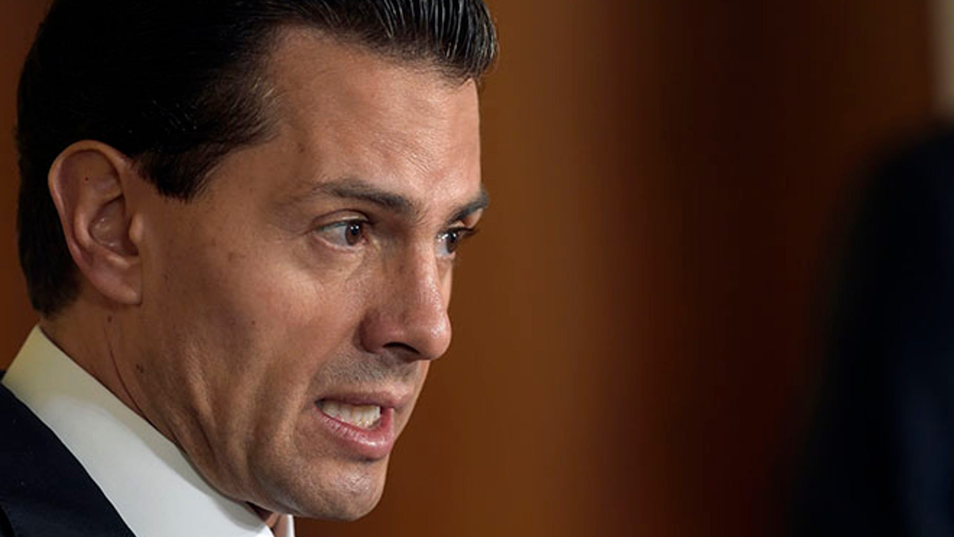FILE - In this July 22, 2016 file photo, Mexican President Enrique Pena Nieto speaks during a news conference with President Barack Obama in the East Room of the White House in Washington. A new poll published Thursday, Aug. 11, 2016 photo by the newspaper Reforma, suggests approval ratings for the Mexican leader have fallen to 23 percent, while 74 percent disapprove of the job he is doing. The level is the lowest since Pena Nieto took office in December 2012, when he got a 42-percent approval rating in the same poll. (AP Photo/Susan Walsh, File)