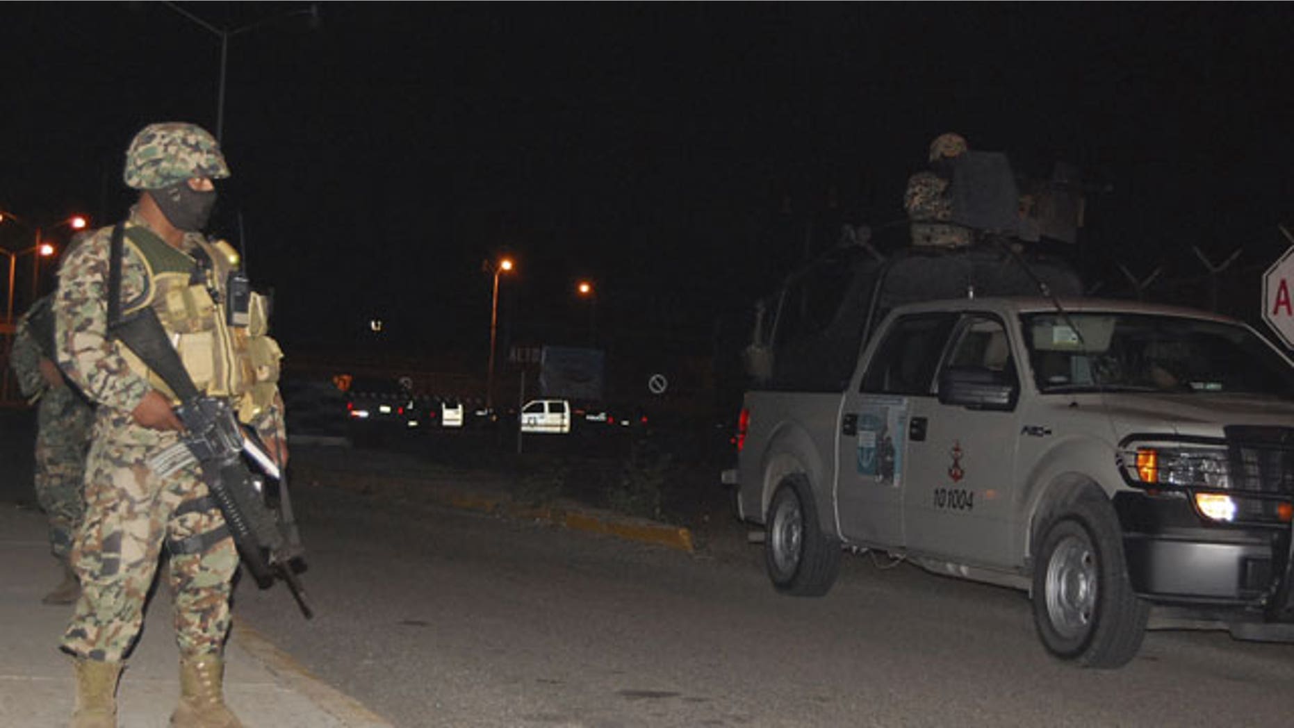 January 4, 2012: Soldiers stand guard outside a prison after a fight between rival gangs in Altamira, Tamaulipas. A fight between rival gangs inside the prison in northern Mexico left 31 inmates dead.