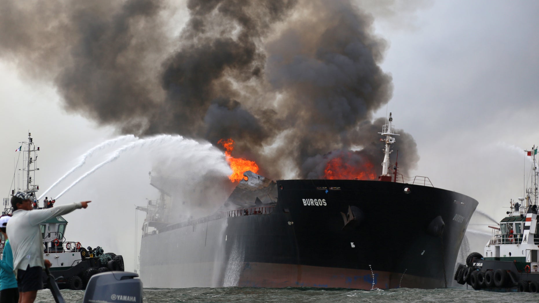 Firefighting boats extinguish a fire aboard the tanker Burgos in Boca del Rio, Mexico, Sept. 24, 2016.