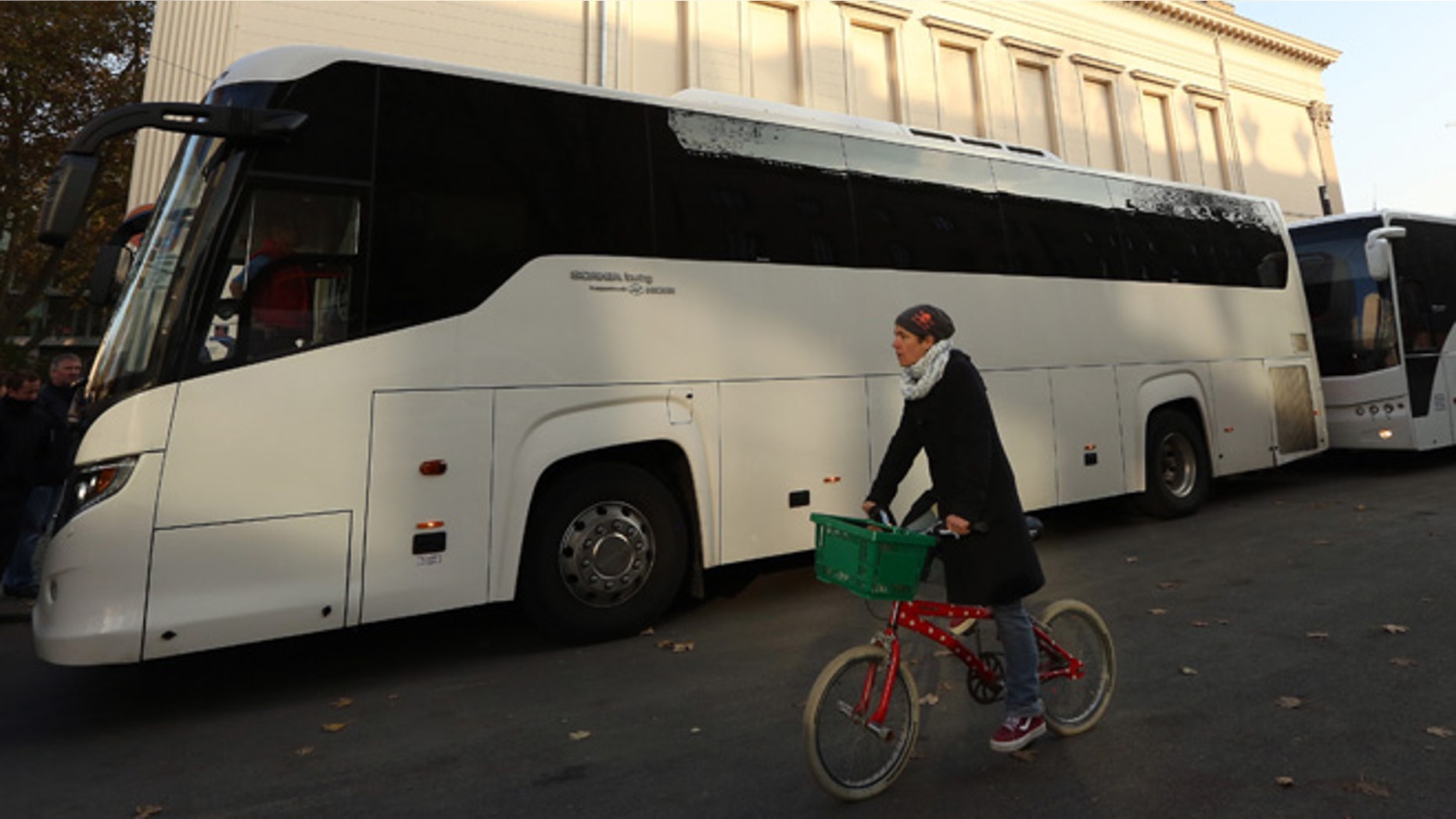 BERLIN, GERMANY - NOVEMBER 07: Two buses full of activists traveling from Berlin to the Mediterranean to 'Tear down the European Wall,' or cut down portions of the European Union's border fence, prepare to depart from outside the Gorki Theater on November 7, 2014 in Berlin, Germany. Amidst ongoing celebrations for the 25th anniversary of the Fall of the Berlin Wall, activists from the group Center for Political Beauty (CPB, or Zentrum fuer Politische Schoenheit, ZPS, in German) claim to have removed 14 white crosses from the city center placed in memory of some of the victims killed trying to cross from East to West Berlin during the Cold War, a protest designed to call attention to the activists' perceived hypocrisy found in fortifying the border preventing entry for refugees into Europe while celebrating the fall of the notorious one in Berlin a quarter of a century ago. The artist collective claims to have given the crosses to refugees from Mali hiding in the forests of Mount Gurugu in northern Morocco who are trying to cross into Melilla, one of two Spanish enclaves in the region, for passage into Europe. (Photo by Adam Berry/Getty Images)