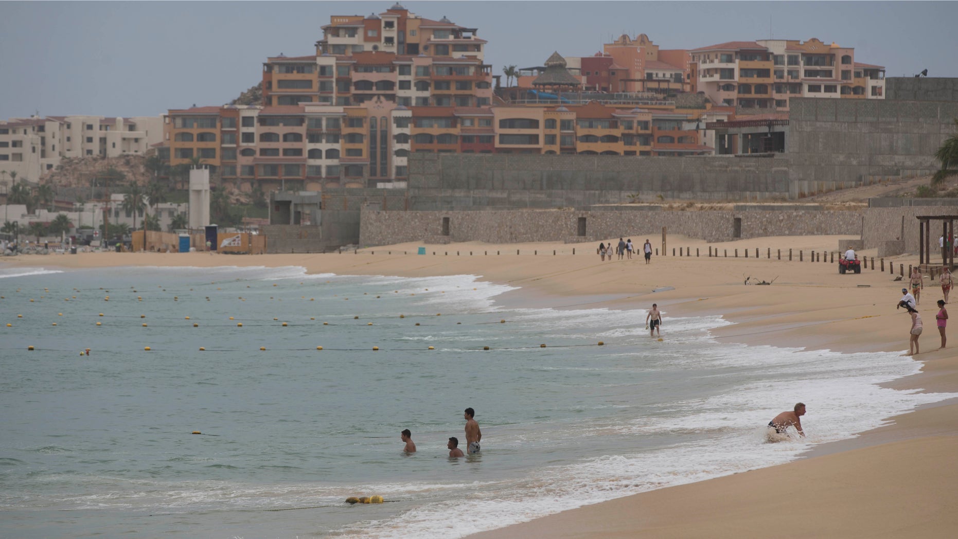 People wade in the waters of El Medano Beach before the arrival of Hurricane Blanca, in Cabo San Lucas, Mexico, Saturday, June 6, 2015. The unpredictable Blanca, which strengthened suddenly from a Category 1 to a Category 4 storm on Saturday before weakening slightly, is expected to make landfall as a tropical storm on Monday. But authorities said its outer bands could start hitting the southern Baja California Peninsula as a hurricane on Sunday. (AP Photo/Eduardo Verdugo)