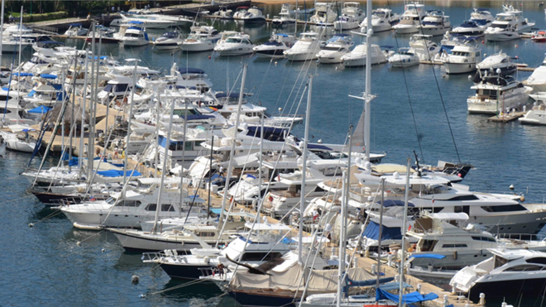 In this Tuesday, Jan. 7, 2014 photo, yachts are docked at a marina in the Bay of Acapulco, Mexico. After inspecting more than 1,600 vessels in late November, the Mexican governmentâs Treasury Department announced it had initiated seizure orders against hundreds of foreign boats it accused of lacking a temporary import permit which proves that the holders own their boats and promise not to leave them in Mexico or sell them here. Many boat owners say they simply werenât around when authorities came by and slapped liens on the boats barring them from leaving Mexico, and say officials have not told them how they could remedy the situation. Foreign pleasure boat owners call this a heavy-handed crackdown over a minor permit, and they say it threatens a tourism sector Mexico has long sought to promote. (AP Photo/Bernandino Hernandez)