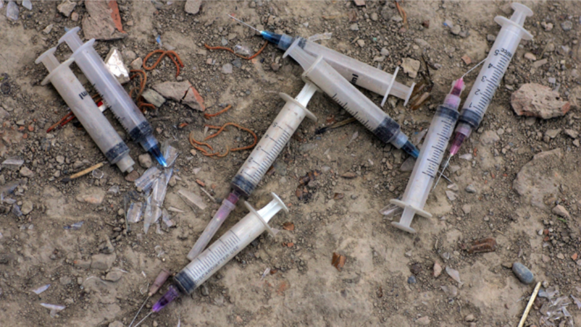 KABUL, AFGHANISTAN - AUGUST 20: Used needles litter the ground outside an abandoned building where many addicts live August 20, 2007 in Kabul, Afghanistan. Fearing an AIDS outbreak many clinics are handing out clean needles instructing the addicts to not resuse them.. The cost for daily use is around $3.00 USD or 150 Afghan currency. Although there are around 35,000 NATO troops in Afghanistan, the drug trade has increased, with Afghanistan producing 95 percent of the world's poppies. According to the UN Office on Drugs and Crime (UNODC), the opium production in 2006 increased 57 percent from 2005, with an additional 15% jump in 2007. (Photo Paula Bronstein/Getty Images)