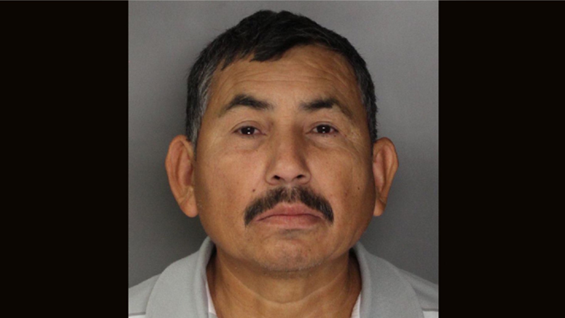 In this handout photo released by the Sacramento County Sheriff's Department is Genaro Olaguez, who was arrested and sent back to Mexico on allegations that he killed eight government officials in Mexico. Olaquez was arrested in Sacramento, Calif., Tuesday, Dec. 3, 2013, in connection with the May 2, 2000, murders of a commissioner and seven other city officials in Sinaloa, Mexico.(AP Photo/Sacramento County Sheriff's Department)