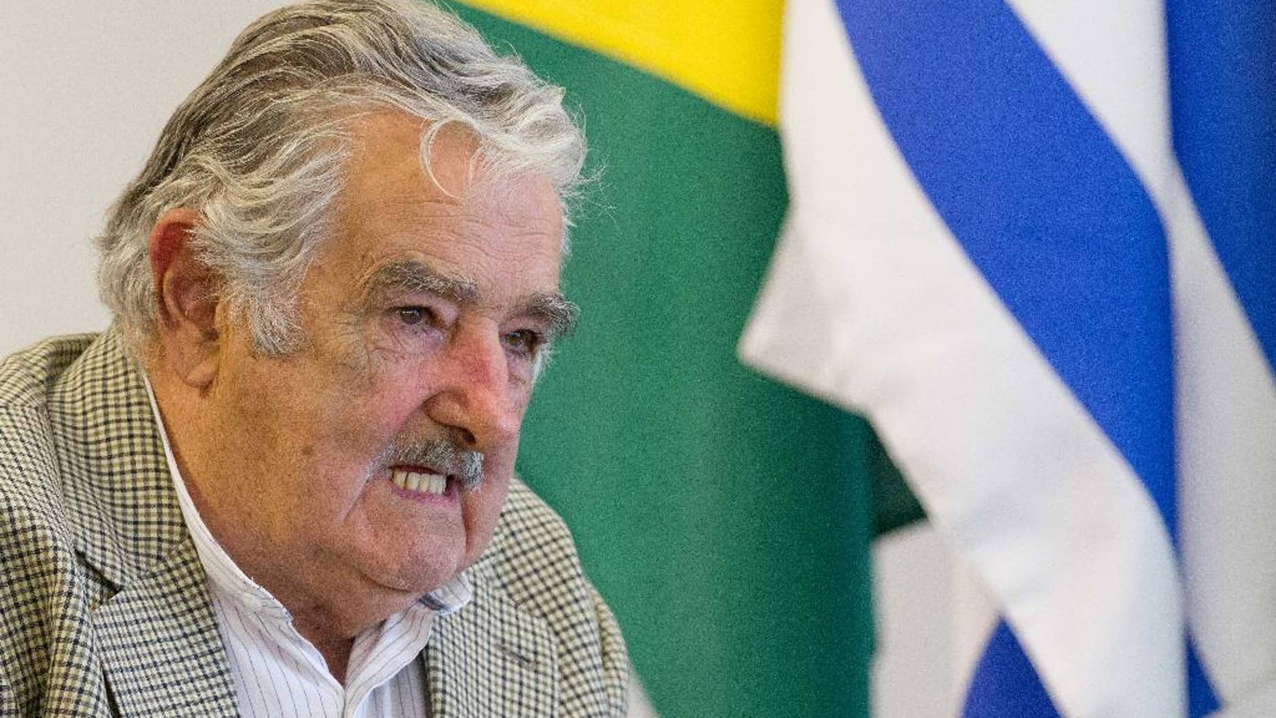 FILE - In this Nov. 7, 2014, file photo, Uruguay's President Jose Mujica meets with Brazil’s President Dilma Rousseff at the Planalto presidential palace, in Brasilia, Brazil. The Mexican foreign office has called in Uruguay’s ambassador on Nov. 23, to ask for an explanation about the words of Uruguayan President Mujica when he said in an interview that Mexico is beginning to feel like a failed state. (AP Photo/Eraldo Peres, File)