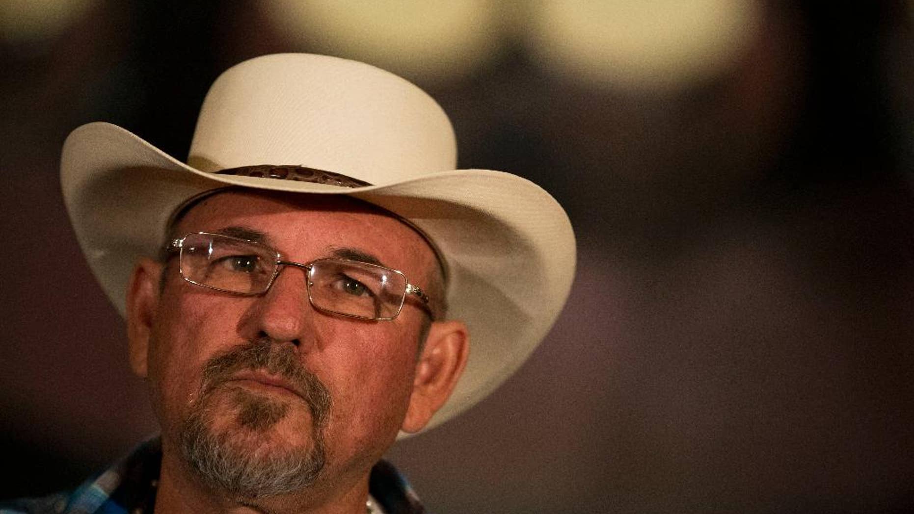 FILE - In this May 28, 2014, file photo, Hipolito Mora, leader of a Michoacan vigilante group, participates in a national meeting of self-defense groups, in Mexico City. Mora, a founder of one of the groups that rose up to confront drug traffickers in the state more than a year ago, said Tuesday Dec. 16, 2014, in a television interview that his group was attacked by a heavily armed rival. The clash occurred at the entrance to the town of La Ruana. Mora said that five or six people were killed, including his son. (AP Photo/Rebecca Blackwell, File)