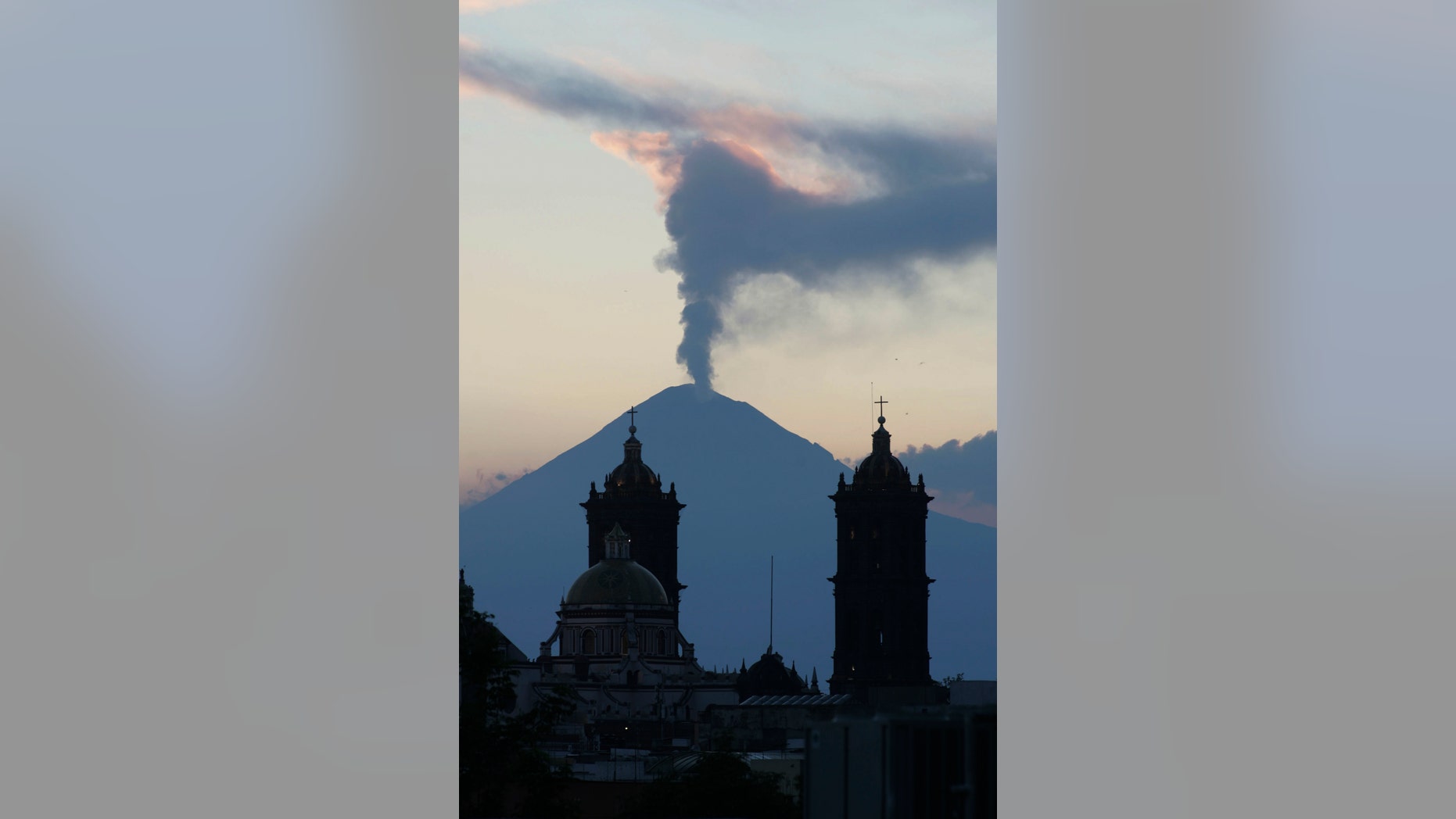 April 14, 2012: A plume of steam rises from the Popocatepetl volcano seen from the city of Puebla, Mexico.