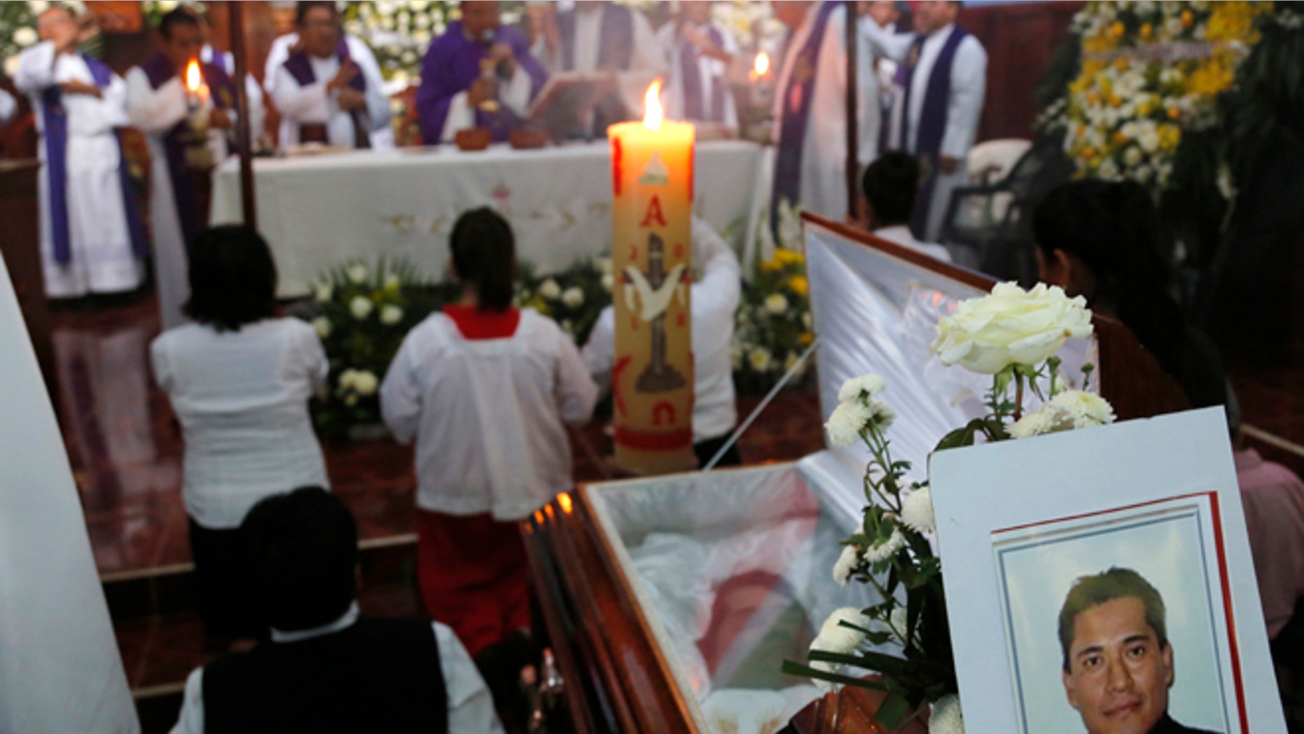 This Sept. 21, 2016 photo shows the funeral Mass for slain Rev. Jose Alfredo Suarez de la Cruz at Our Lady of Asuncion Church in Paso Blanco, Veracruz state, Mexico, his hometown. Church leaders are increasingly frustrated by authoritiesââ¬â¢ inability to protect their priests under Mexican President Enrique Pena Nietoââ¬â¢s administration. (AP Photo/Marco Ugarte)