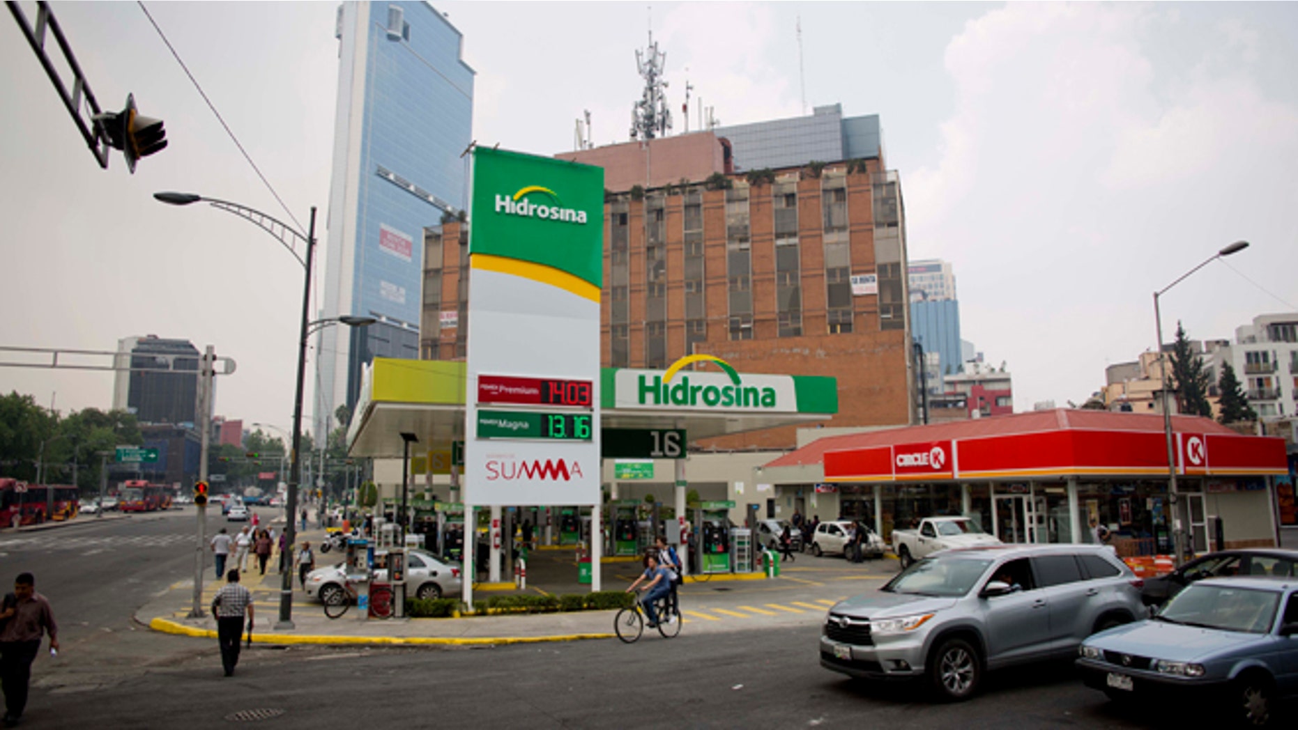 Hidrosina opened a re-branded Pemex gas station on one of the main avenues in Mexico City, Tuesday, June 7, 2016. Mexico's ubiquitous Pemex gas stations now have competition along the country's highways and city streets for the first time in nearly eight decades. Two companies have collectively opened three gas stations under their own brands, breaking one of the state-owned petroleum company's last monopolies. Opening the retail sector to competition was part of energy reforms passed in 2014. (AP Photo/Eduardo Verdugo)