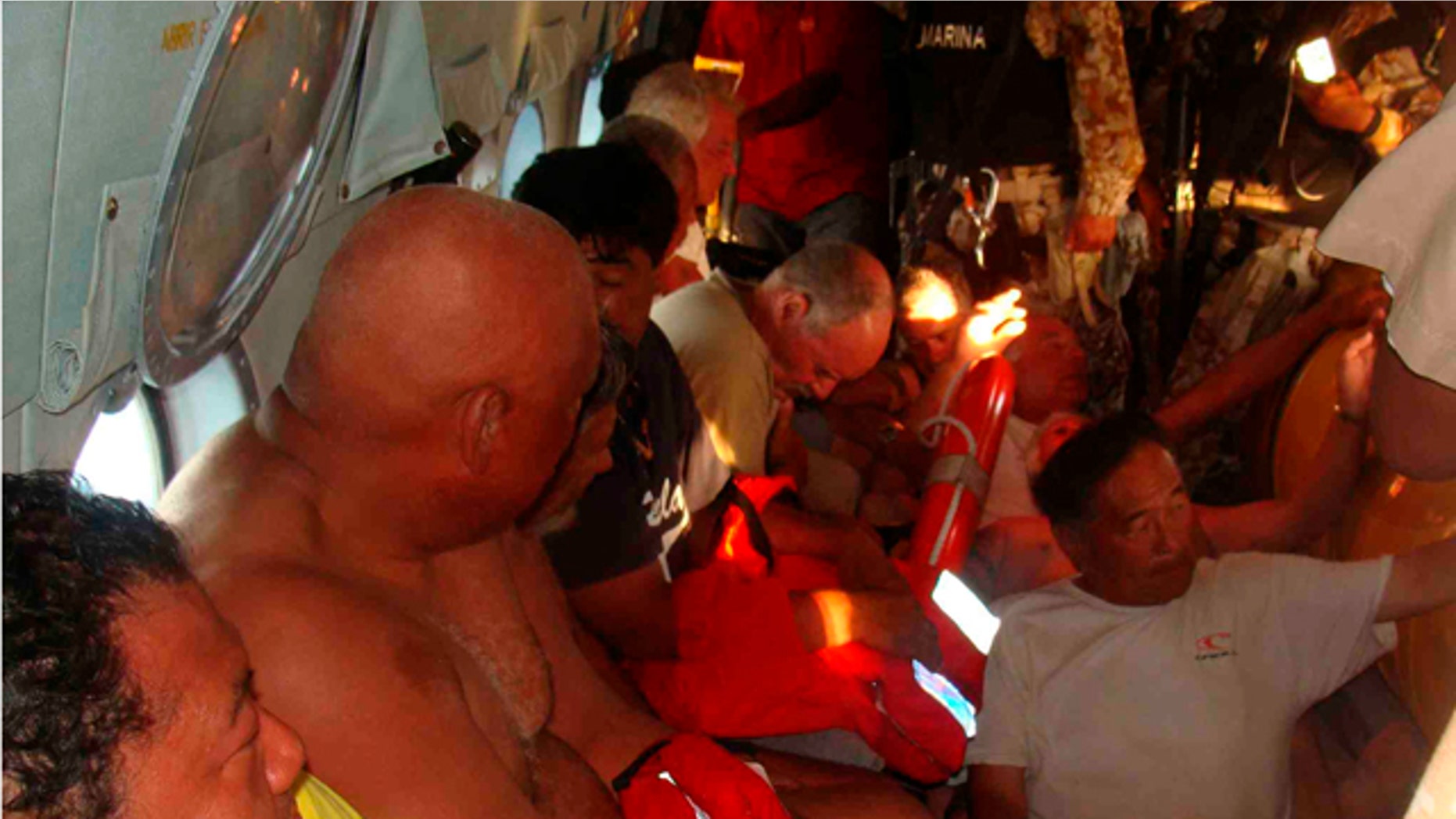 July 4: Survivors of a capsized boat inside a helicopter after being rescued by the Navy in the town of San Felipe.