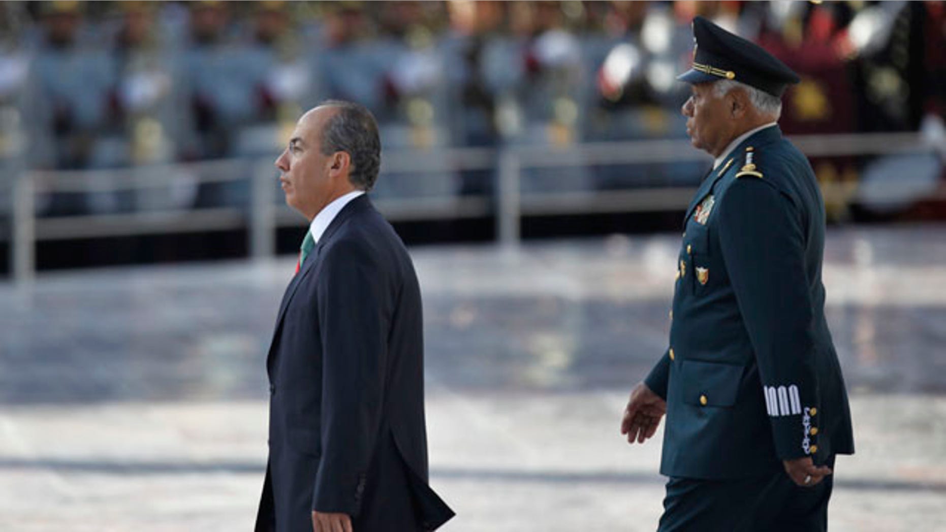 September 13: Mexico's President Felipe Calderon, walks along Mexico's Defense Secretary Guillermo Galvan during the anniversary of the battle of the "Ninos Heroes", or Heroic Childre in Mexico City. The "Ninos Heroes", or Heroic Children were a group of young cadets who died defending the military academy in Mexico City during the Mexican-American war in 1847. (AP)