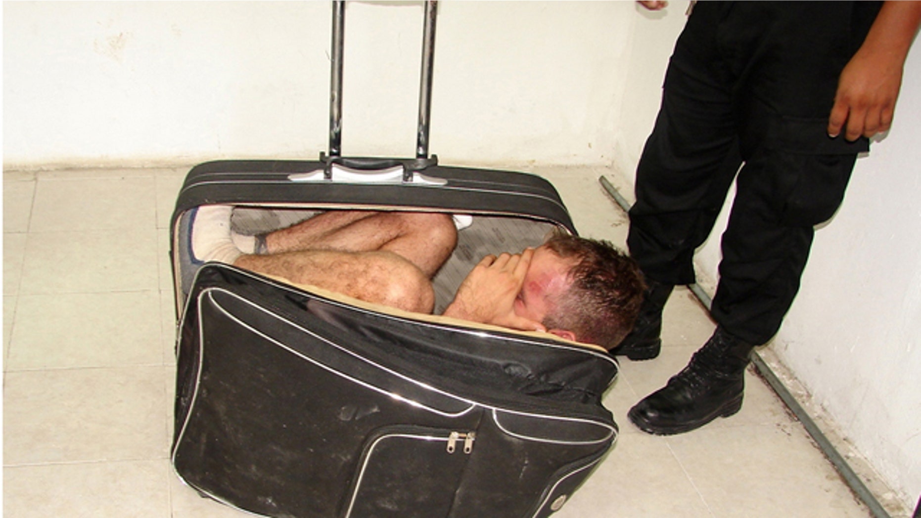 July 2: Inmate Juan Ramirez Tijerina inside a suitcase after he tried to escape from prison with the help of his girlfriend following a conjugal visit in Chetumal, Mexico.