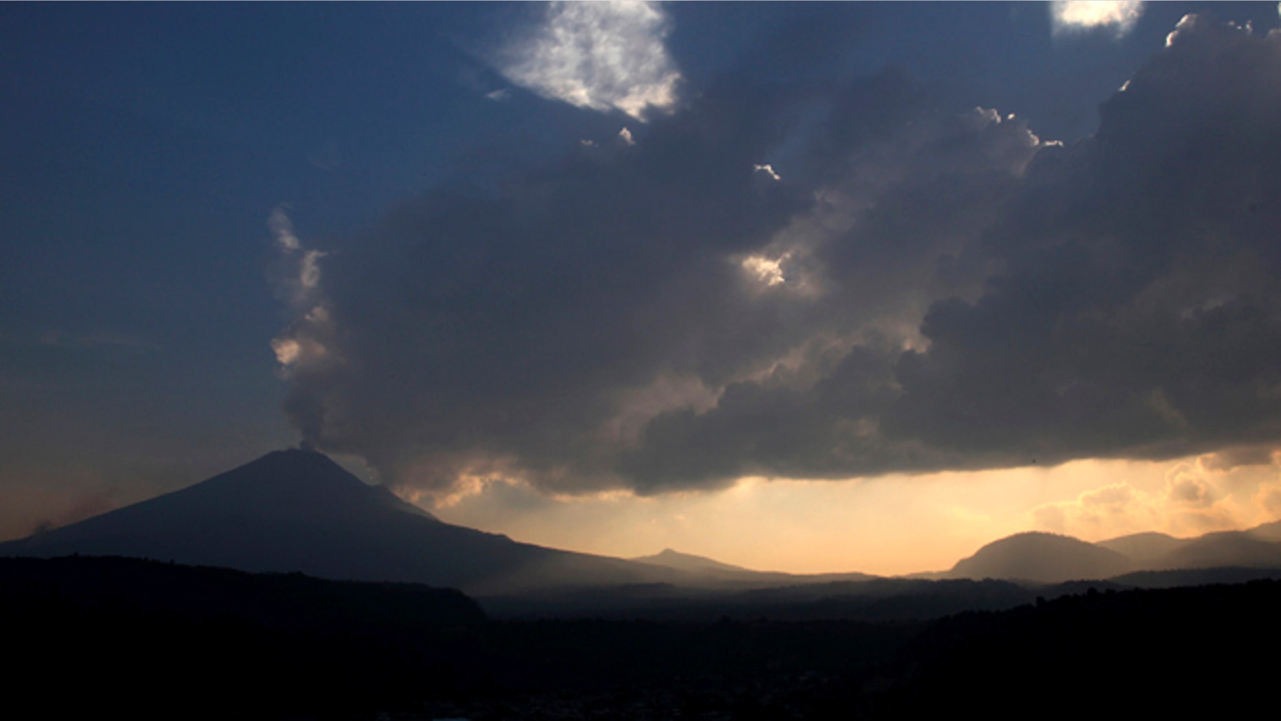 May 12, 2013: The Popocatepetl volcano spews ash and steam as seen from Santiago Xalitzintla, Mexico.