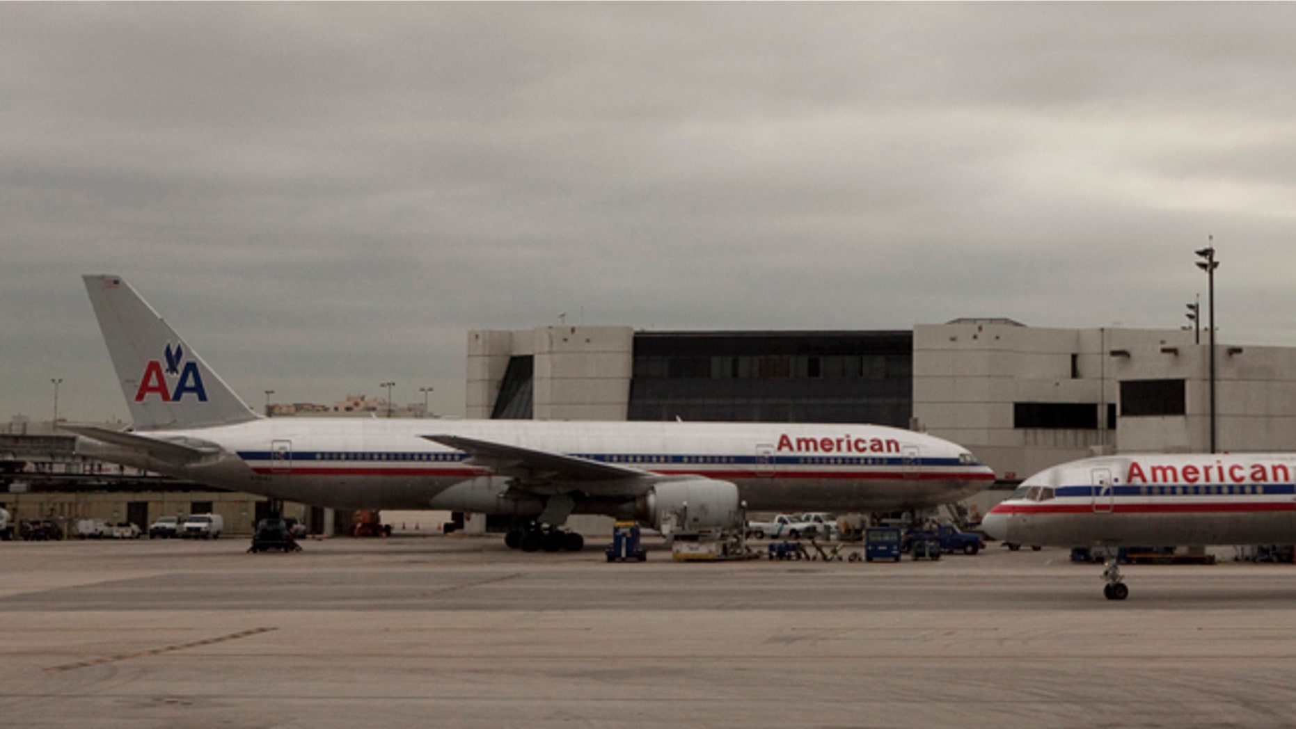 American Airlines planes taxi past a terminal at Miami International airport in Miami, Florida.