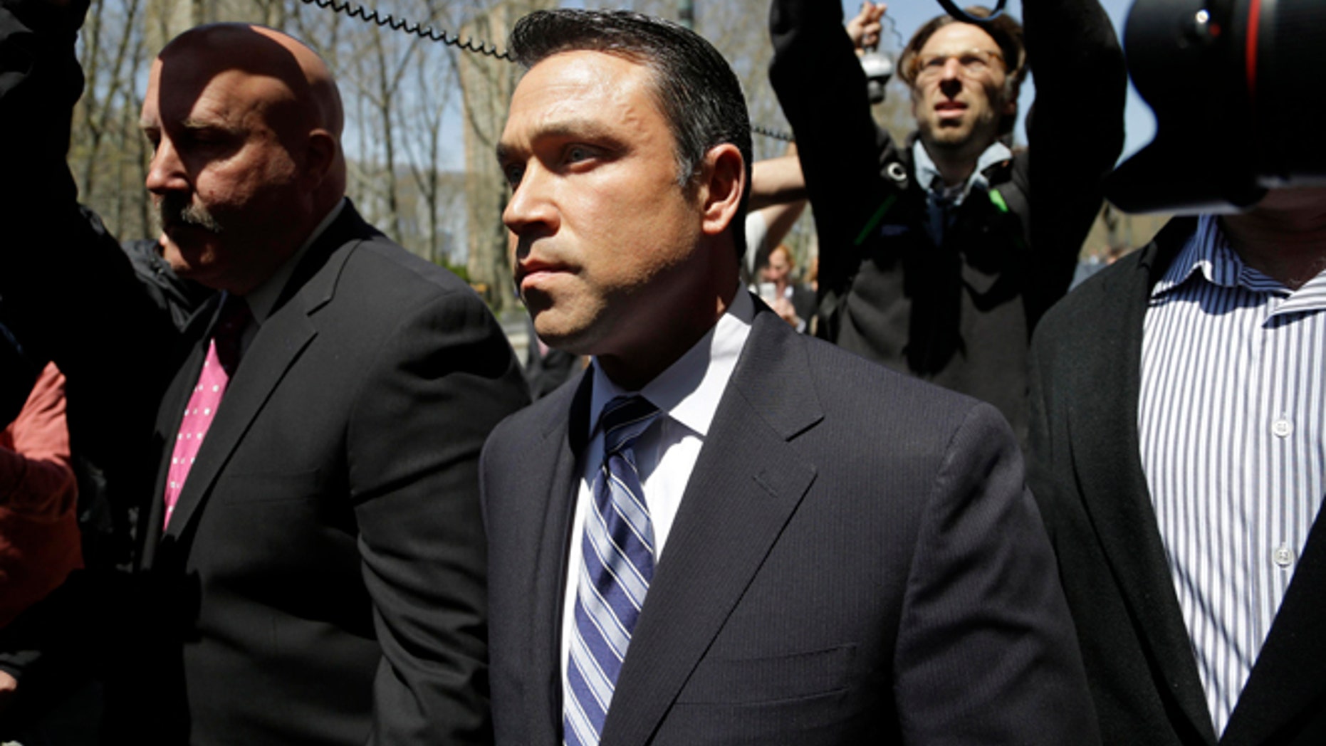 U.S. Rep. Michael Grimm leaves federal court in New York, Monday, April 28, 2014. Grimm was taken into custody Monday to face federal charges following a two-year investigation of his campaign financing. (AP Photo/Seth Wenig)