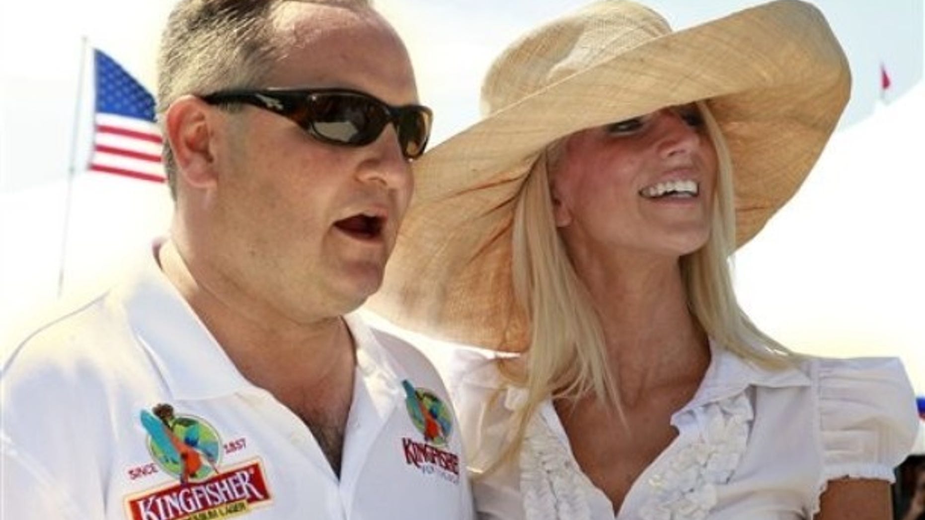 Tareq Salahi, left, and Michaele Salahi host the America's Polo Cup Championships by the National Mall in Washington, on Saturday, June 12, 2010. (AP Photo/Jacquelyn Martin)