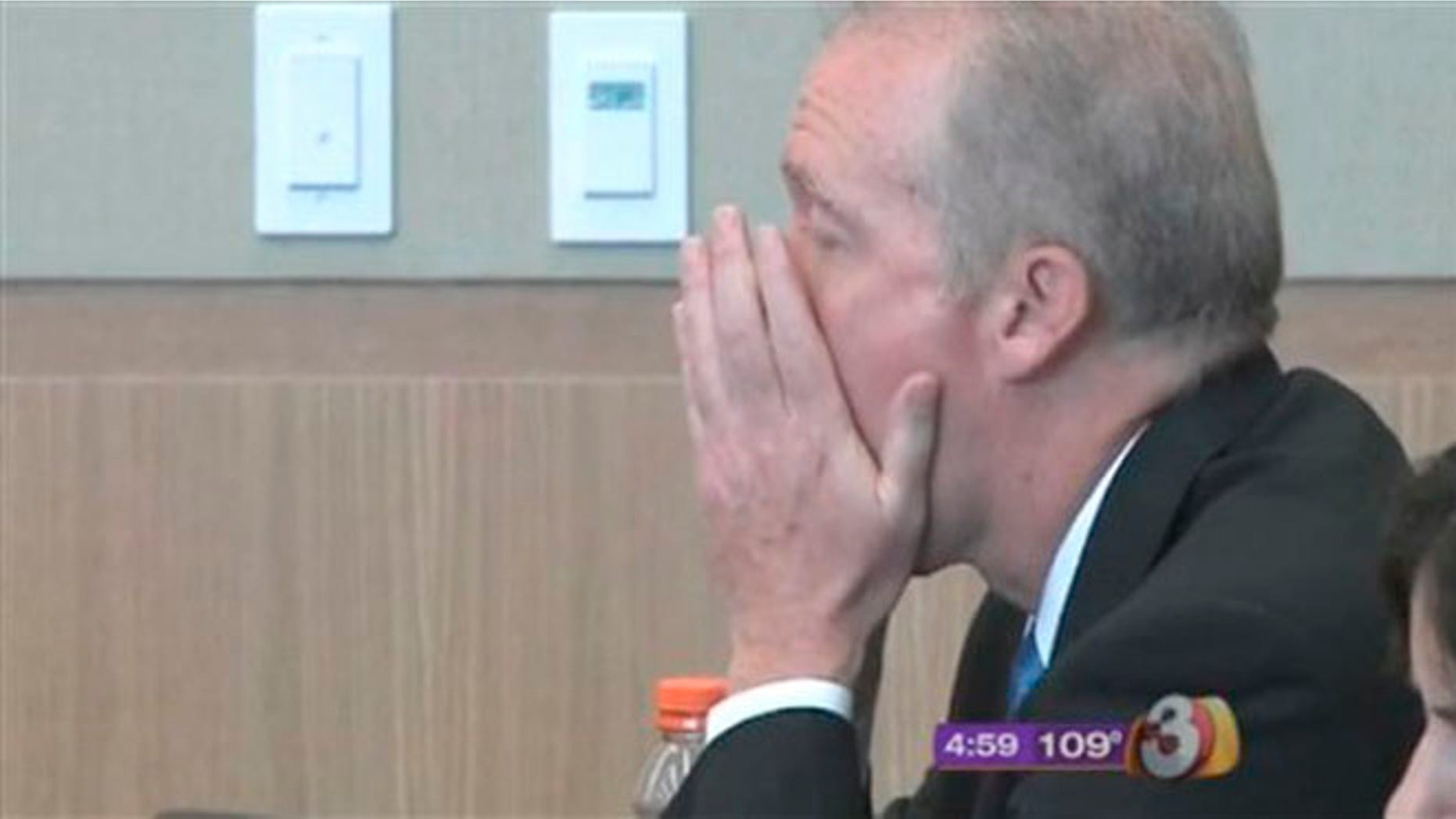 June 29, 2012: In this image taken from video provided by KTVK, 53-year-old Michael Marin puts his hands to his face after he was found guilty of deliberately burning down his $3.5 mansion at the Maricopa County Superior Court in Phoenix.