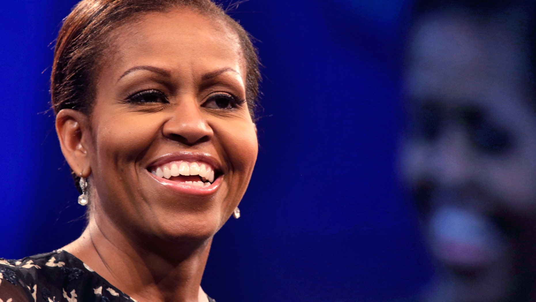 First lady Michelle Obama speaks about childhood obesity at the annual meeting of the National Council of La Raza, in New Orleans, Tuesday, July 23, 2013. The conference and a related "Family Expo" were expected to draw an estimated 25,000 participants. (AP Photo/Gerald Herbert)