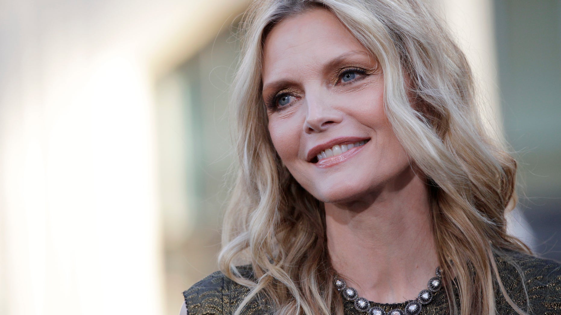 Cast member Michelle Pfeiffer poses at the premiere of the film "Dark Shadows" at the Grauman's Chinese theatre in Hollywood, California May 7, 2012.