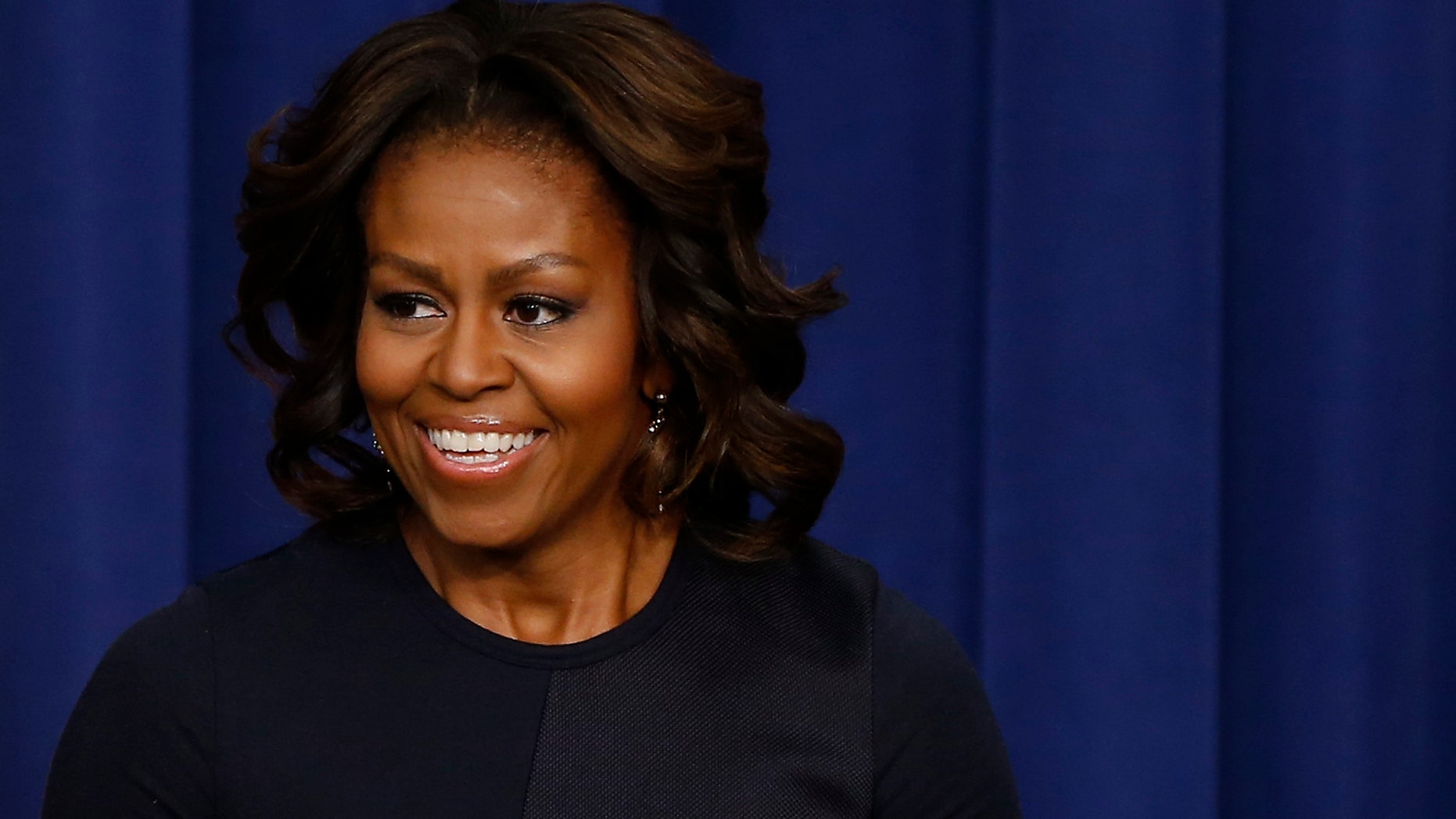 First lady Michelle Obama speaks in the Eisenhower Executive Office Building on the White House complex in Washington.